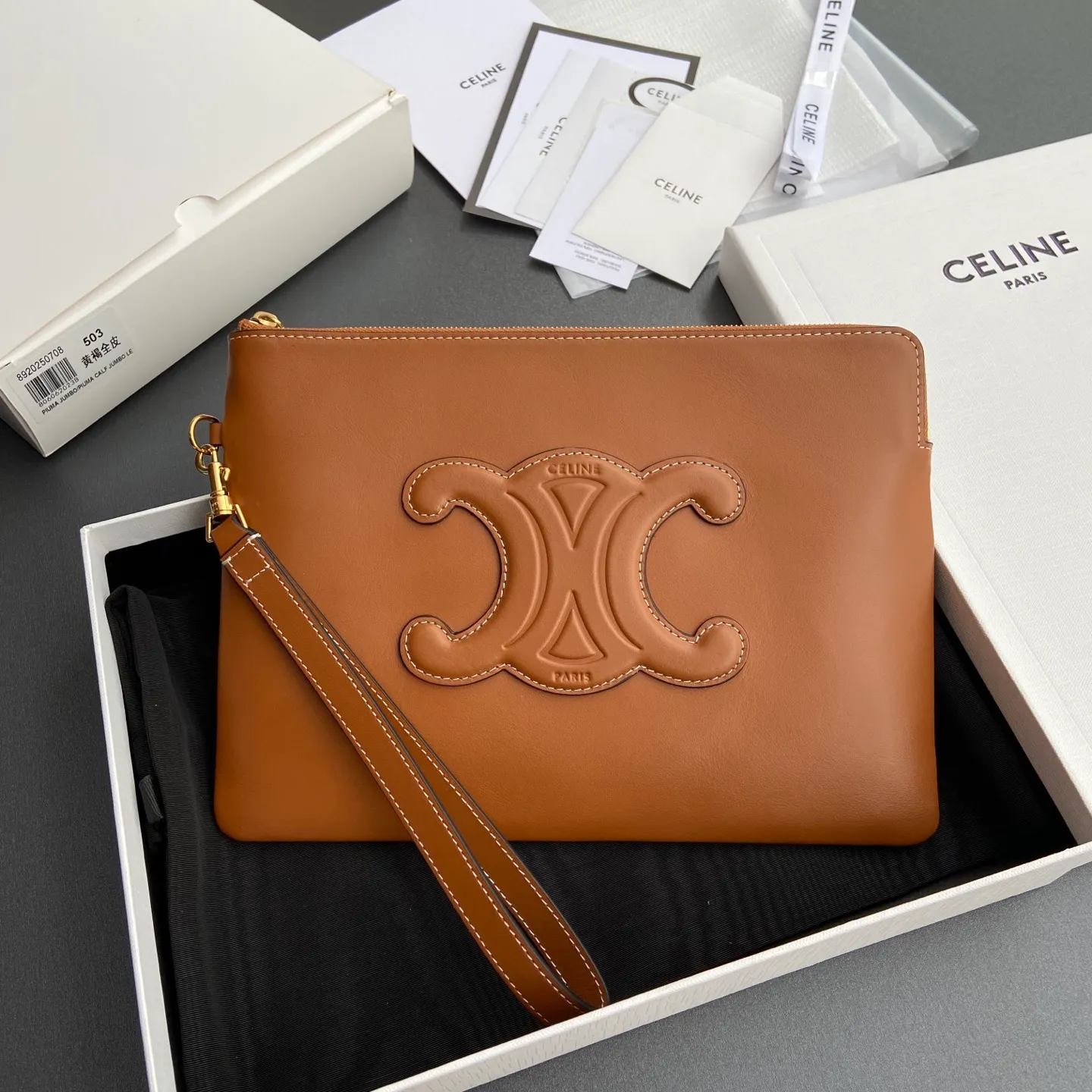 [Extra-grade pure steel hardware original leather] ¥860 TRIOMPHE smooth full leather clutch bag / 1 zipper compartment Detachable wrist strap, about 20 cm in length Lining: cowhide lining Number: 10J502FES.04LU 502 503 Yellow brown full leather Size: w25×h17.5×d1cm