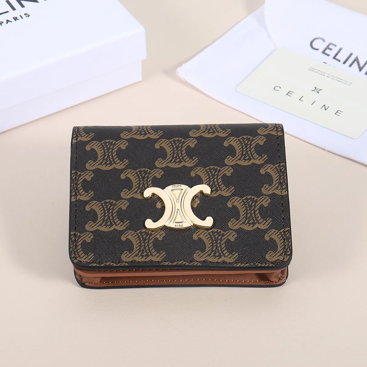 60. Celine classic card holder, TRIOMPHE business card holder, large cowhide interior with plain microfiber TRIOMPHE CANVAS logo print, gold finish TRIOMPHE metal snap closure, 1 zipper coin pocket, 5 card slots, 1 banknote pocket, 1 flat pocket No.: 10K623 Size: 11 X 9 X 3 cm
