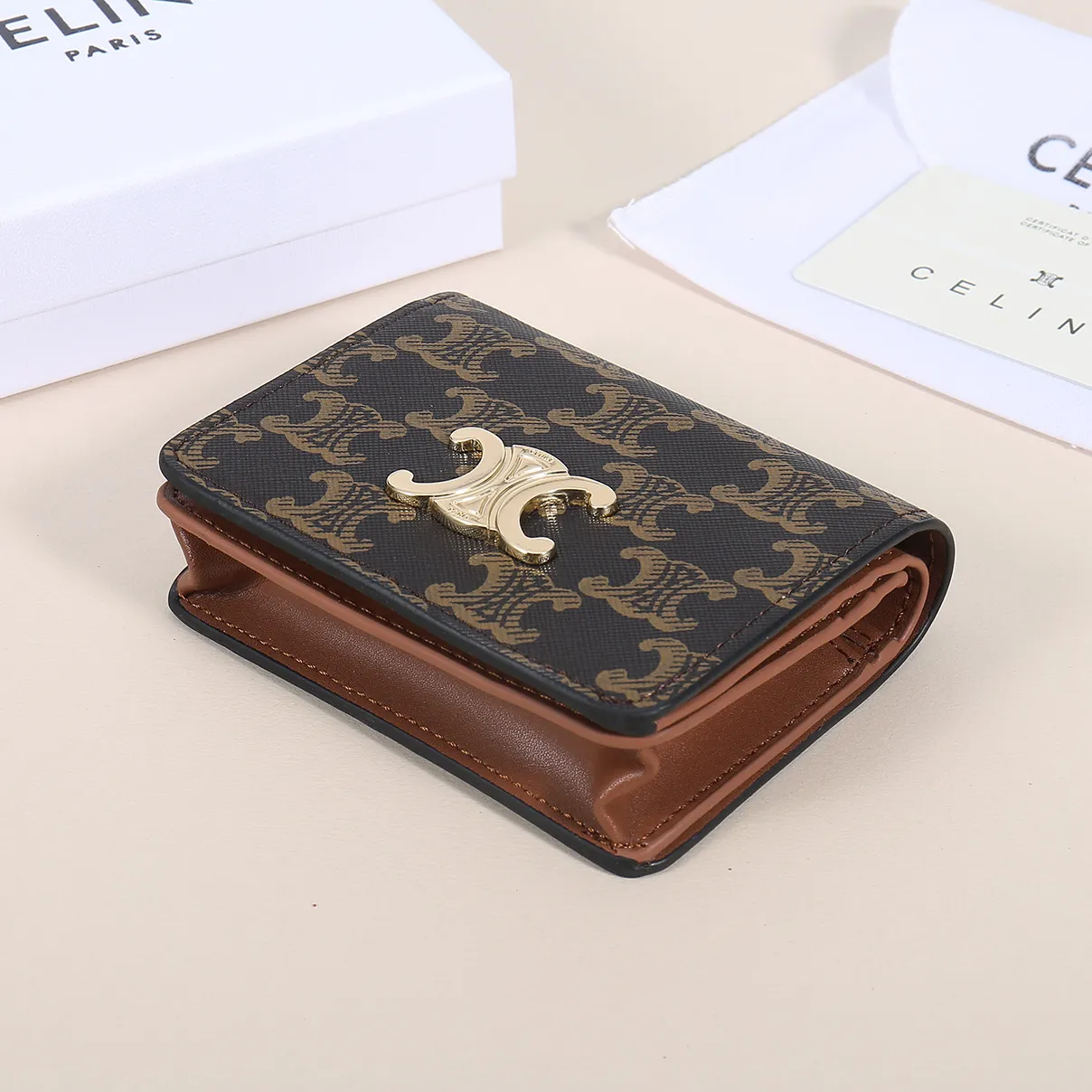 60. Celine classic card holder, TRIOMPHE business card holder, large cowhide interior with plain microfiber TRIOMPHE CANVAS logo print, gold finish TRIOMPHE metal snap closure, 1 zipper coin pocket, 5 card slots, 1 banknote pocket, 1 flat pocket No.: 10K623 Size: 11 X 9 X 3 cm