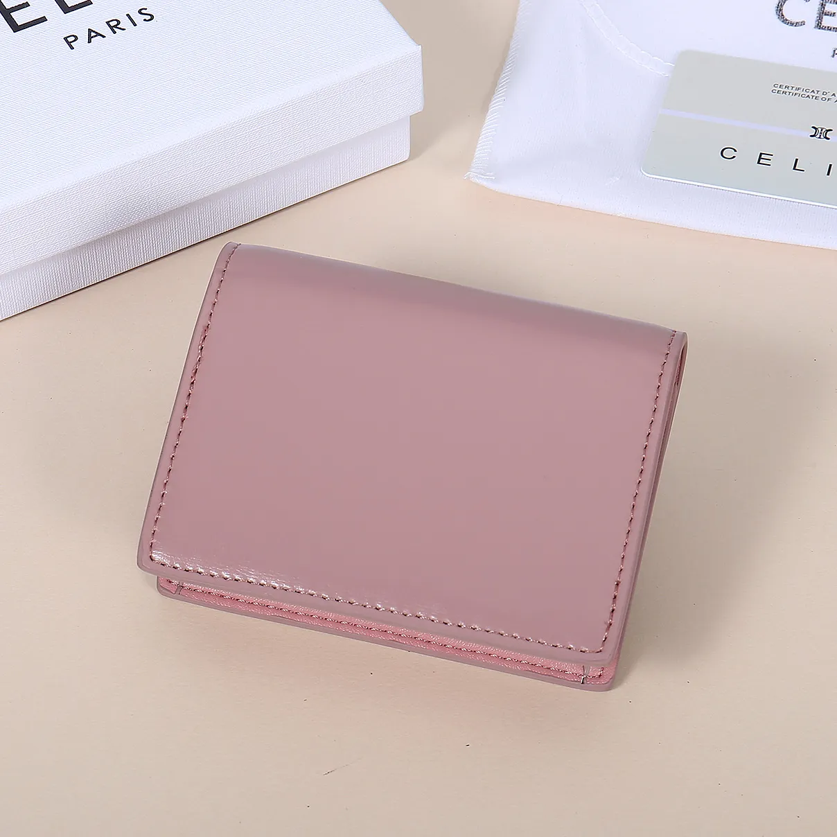 💰130, Celine's new card holder, TRIOMPHE business card holder, large cowhide with plain microfiber interior, gold finish TRIOMPHE metal snap closure, 1 thickened main compartment, 3 inner card slots. No.: 10N063 Size: 10.5x8.5x3 cm