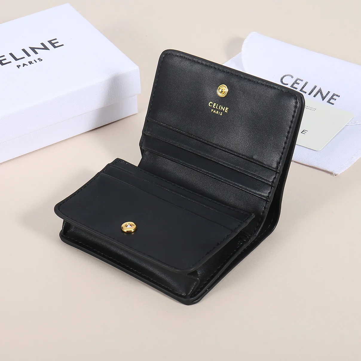 60. Celine classic card holder, TRIOMPHE business card holder, large cowhide interior with plain microfiber TRIOMPHE CANVAS logo print, gold finish TRIOMPHE metal snap closure, 1 zipper coin pocket, 5 card slots, 1 banknote pocket, 1 flat pocket No.: 10K623 Size: 11 X 9 X 3 cm
