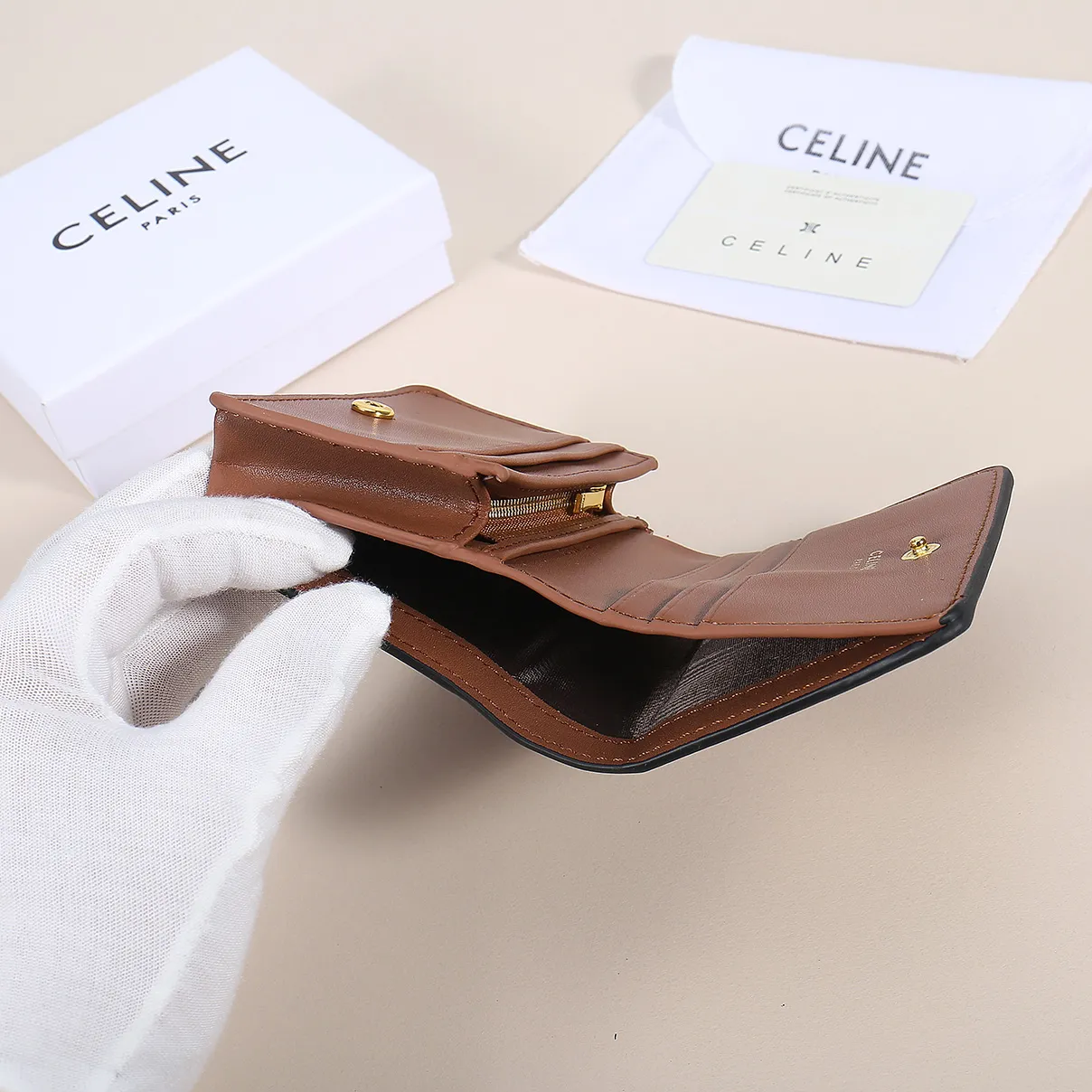 60. Celine classic card holder, TRIOMPHE business card holder, large cowhide interior with plain microfiber TRIOMPHE CANVAS logo print, gold finish TRIOMPHE metal snap closure, 1 zipper coin pocket, 5 card slots, 1 banknote pocket, 1 flat pocket No.: 10K623 Size: 11 X 9 X 3 cm