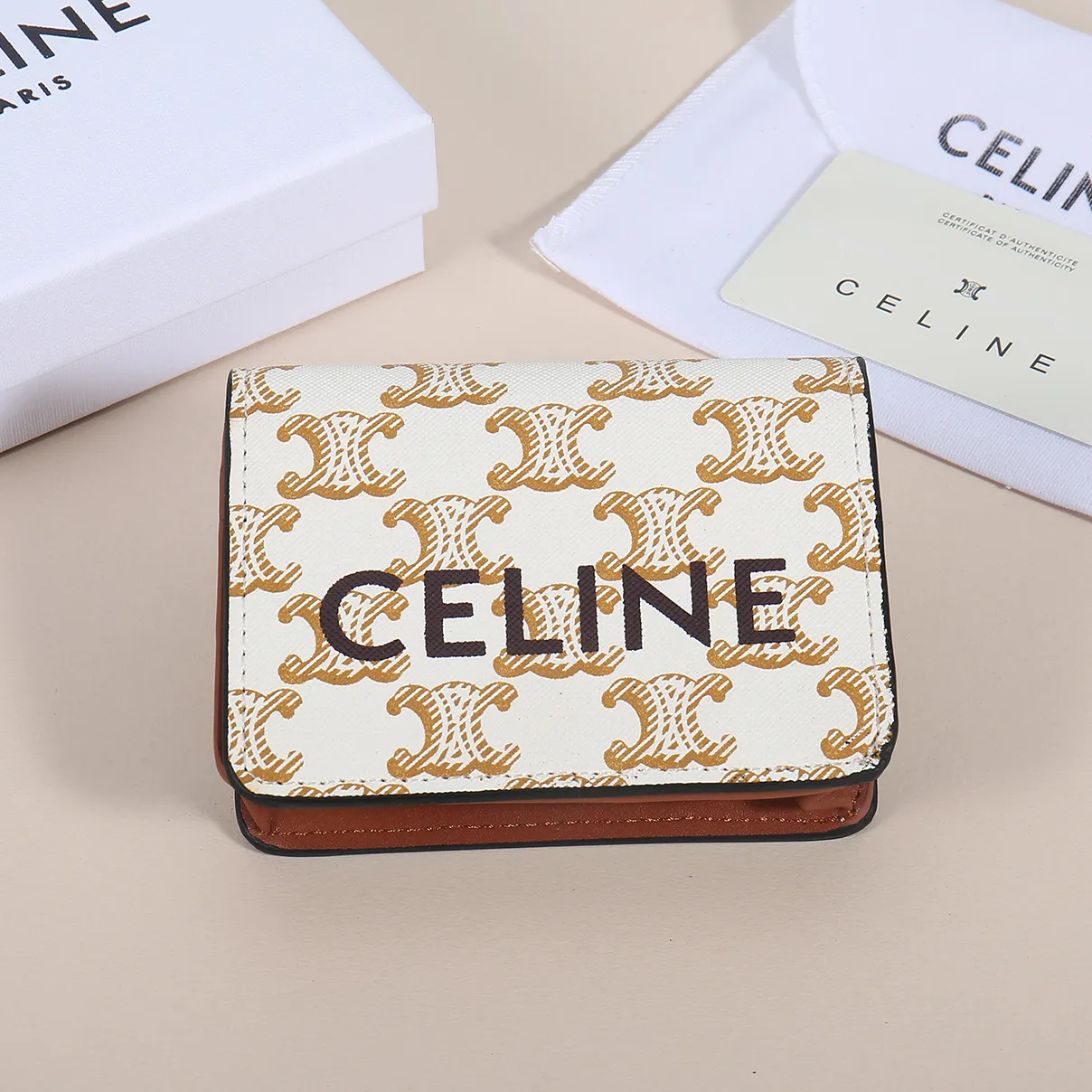 60. Celine classic card holder, TRIOMPHE business card holder, large cowhide interior with plain microfiber TRIOMPHE CANVAS logo print, gold finish TRIOMPHE metal snap closure, 1 zipper coin pocket, 5 card slots, 1 banknote pocket, 1 flat pocket No.: 10K623 Size: 11 X 9 X 3 cm