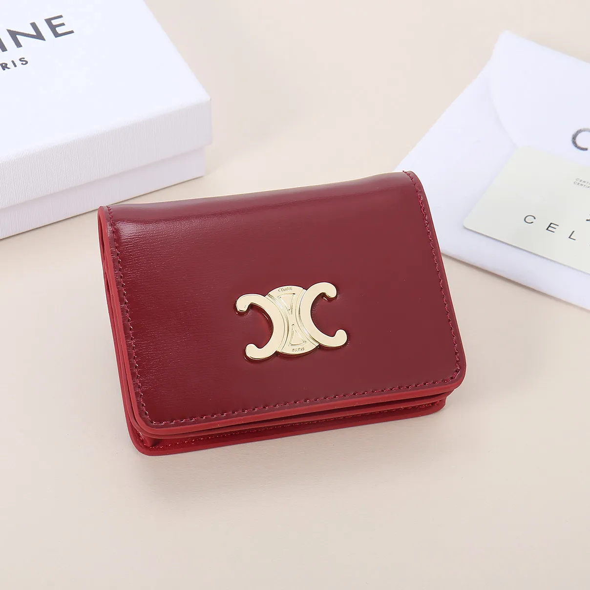 60. Celine classic card holder, TRIOMPHE business card holder, large cowhide interior with plain microfiber TRIOMPHE CANVAS logo print, gold finish TRIOMPHE metal snap closure, 1 zipper coin pocket, 5 card slots, 1 banknote pocket, 1 flat pocket No.: 10K623 Size: 11 X 9 X 3 cm