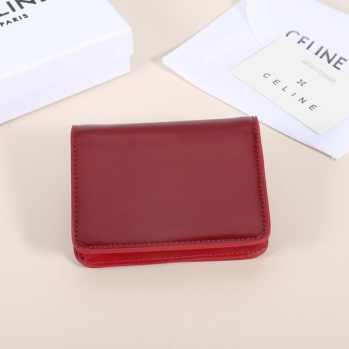 60. Celine classic card holder, TRIOMPHE business card holder, large cowhide interior with plain microfiber TRIOMPHE CANVAS logo print, gold finish TRIOMPHE metal snap closure, 1 zipper coin pocket, 5 card slots, 1 banknote pocket, 1 flat pocket No.: 10K623 Size: 11 X 9 X 3 cm