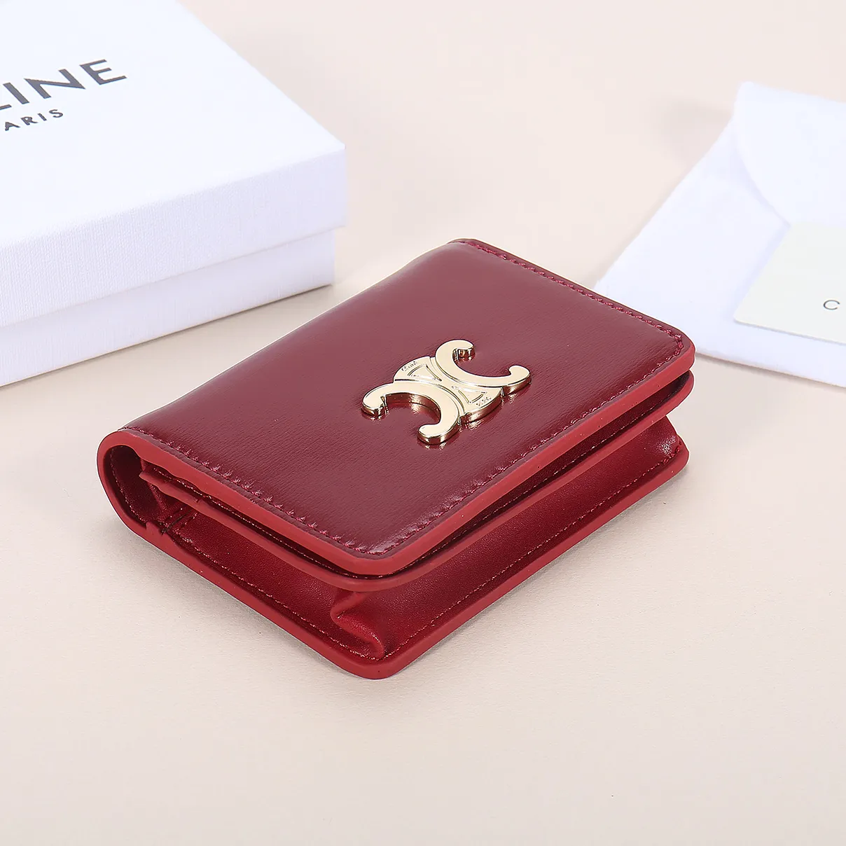 60. Celine classic card holder, TRIOMPHE business card holder, large cowhide interior with plain microfiber TRIOMPHE CANVAS logo print, gold finish TRIOMPHE metal snap closure, 1 zipper coin pocket, 5 card slots, 1 banknote pocket, 1 flat pocket No.: 10K623 Size: 11 X 9 X 3 cm