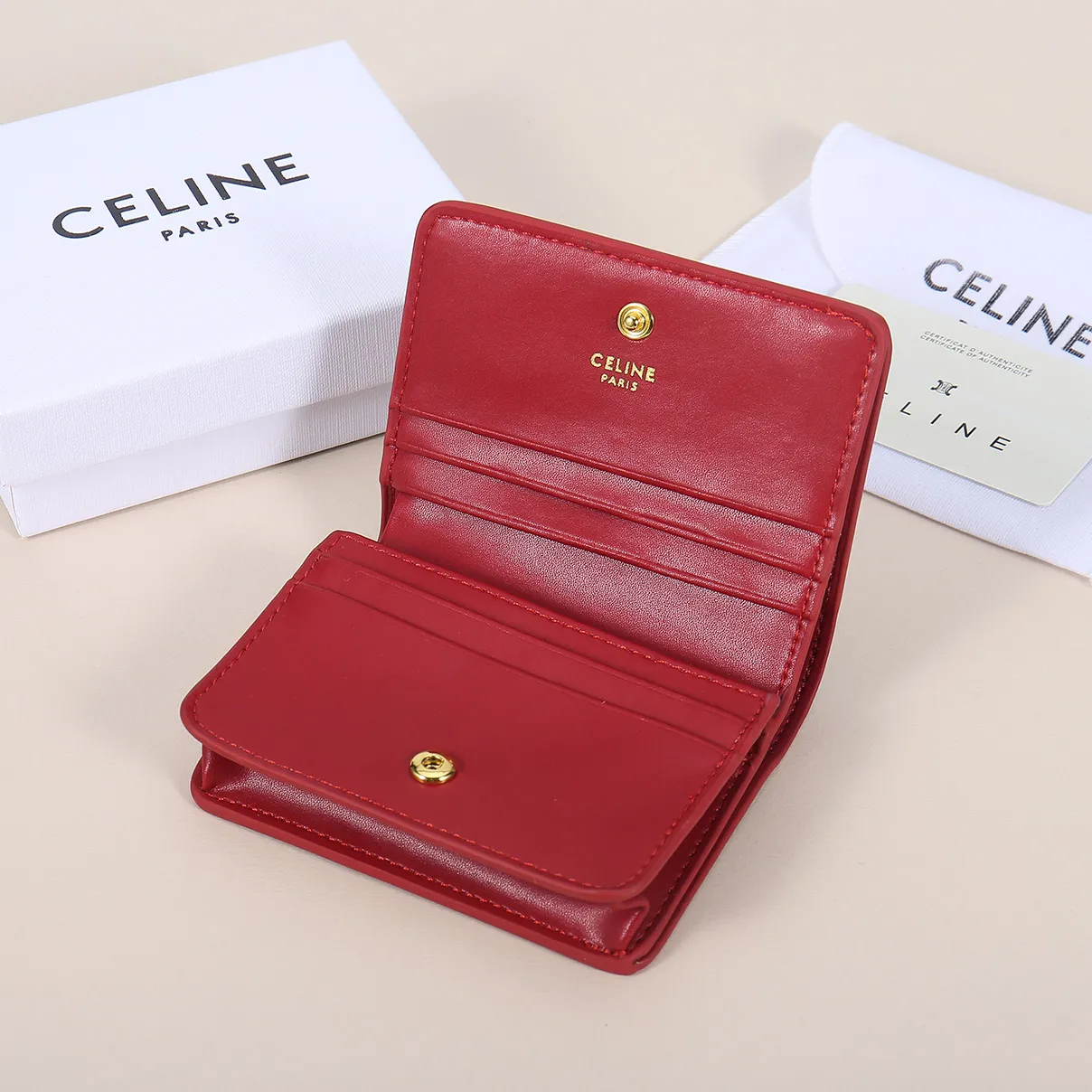 60. Celine classic card holder, TRIOMPHE business card holder, large cowhide interior with plain microfiber TRIOMPHE CANVAS logo print, gold finish TRIOMPHE metal snap closure, 1 zipper coin pocket, 5 card slots, 1 banknote pocket, 1 flat pocket No.: 10K623 Size: 11 X 9 X 3 cm