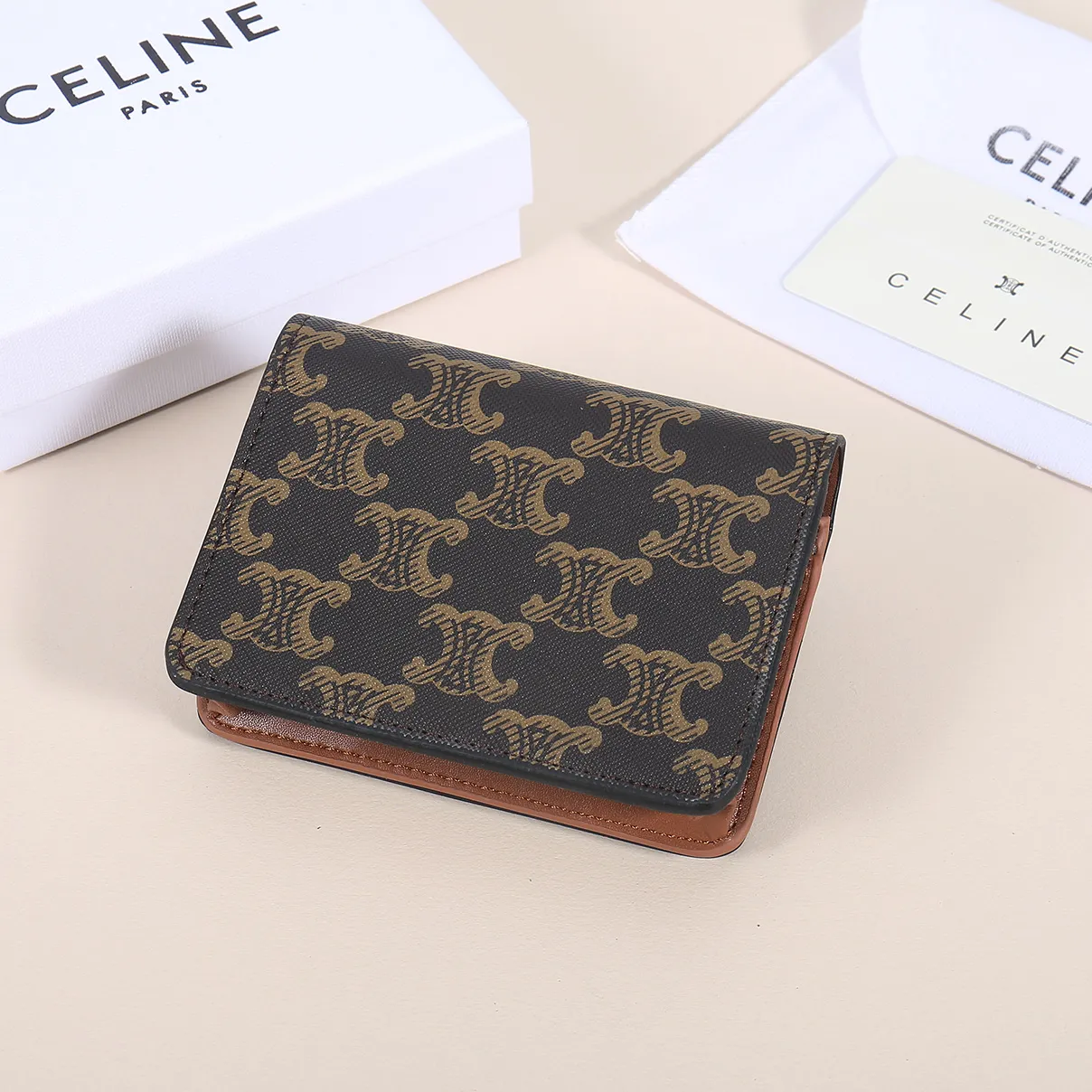 60. Celine classic card holder, TRIOMPHE business card holder, large cowhide interior with plain microfiber TRIOMPHE CANVAS logo print, gold finish TRIOMPHE metal snap closure, 1 zipper coin pocket, 5 card slots, 1 banknote pocket, 1 flat pocket No.: 10K623 Size: 11 X 9 X 3 cm