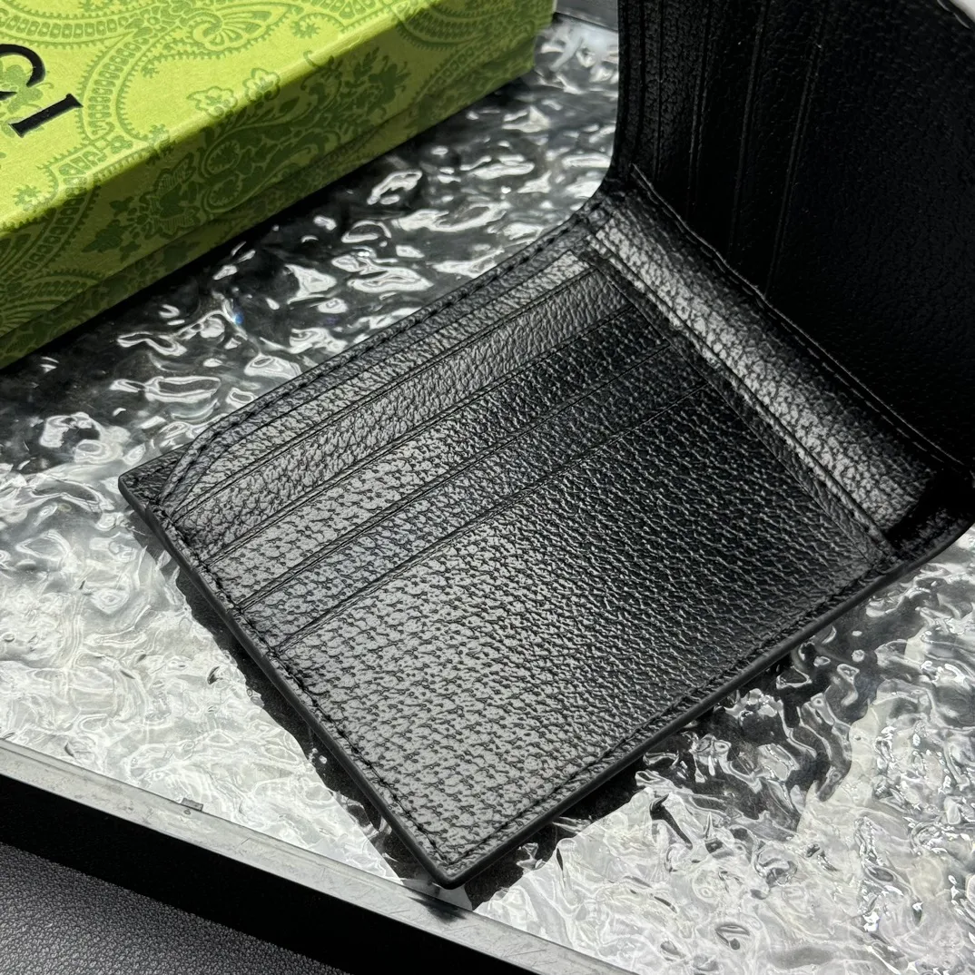 💰120 💎Top original version 🇮🇹GG Marmont series leather bi-fold wallet, Gucci continues to update the color matching, adding more refined tones. In new colors and combinations, the brand uses a modern perspective to reinterpret the classic GG Marmont series. This bifold wallet is crafted from black leather with branded hardware in gold-tone. Black leather, gold-tone hardware, Double G, eight card slots, two bill compartments. Model: 523664. Dimensions: 11x9