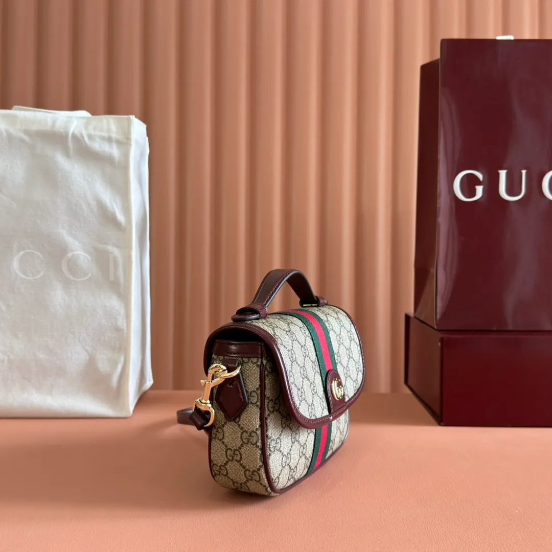 p960. 💋💋💋"With full set of original counter packaging"💋[New Product] The Ophidia series dazzlingly presents novel silhouettes and functions. It is ingeniously interpreted in iconic beige and brown colors to create a new bag item with soft texture. Beige and dark brown GG canvas Ankara red leather trim Light gold tone hardware Green cotton lining Double G Interior: One open pocket Carry handles (2.5 cm high) Removable and adjustable leather shoulder strap (height: 46 cm to 54 cm; length: 101 cm to 116 cm) Ident.: 836843. Dimensions: 20cm (width) x 16cm (height) x 5cm (depth) Weight: approx. 0.55kg Color: Brown Anchor Red/PVC. Made in Italy