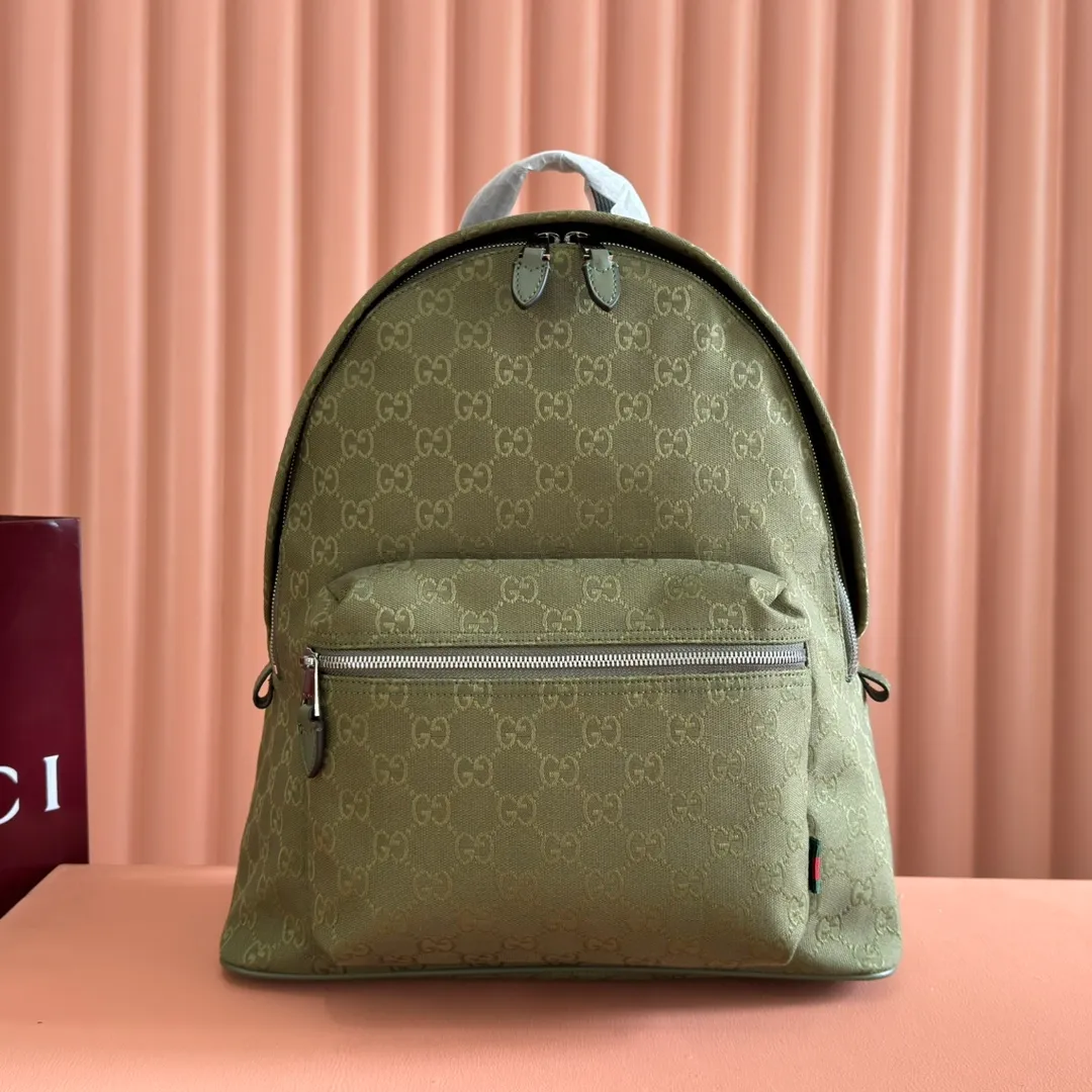 p1240. 💋💋💋【With full set of original counter packaging】【New Product】This backpack is crafted with GG canvas to pay tribute to the instantly recognizable monogram pattern of Guccio Gucci, the founder of the brand. Interpreting a new forest green tone, it adds a modern touch to daily accessories, and the webbing details double the charm of the entire design. Forest green GG canvas Forest green leather trim Red and green web detail Gucci branding on the back Nylon lining Padded mesh on the back Adjustable padded shoulder strap Interior: 1 padded laptop compartment, 1 open pocket External: One zippered pocket Handle height: 8 cm Zipper closure Ident number: 834464. Dimensions: 35cm (width) x 40cm (height) x 20cm (depth) Weight: approx. 1.3kg Color: Forest green cloth. Made in Italy