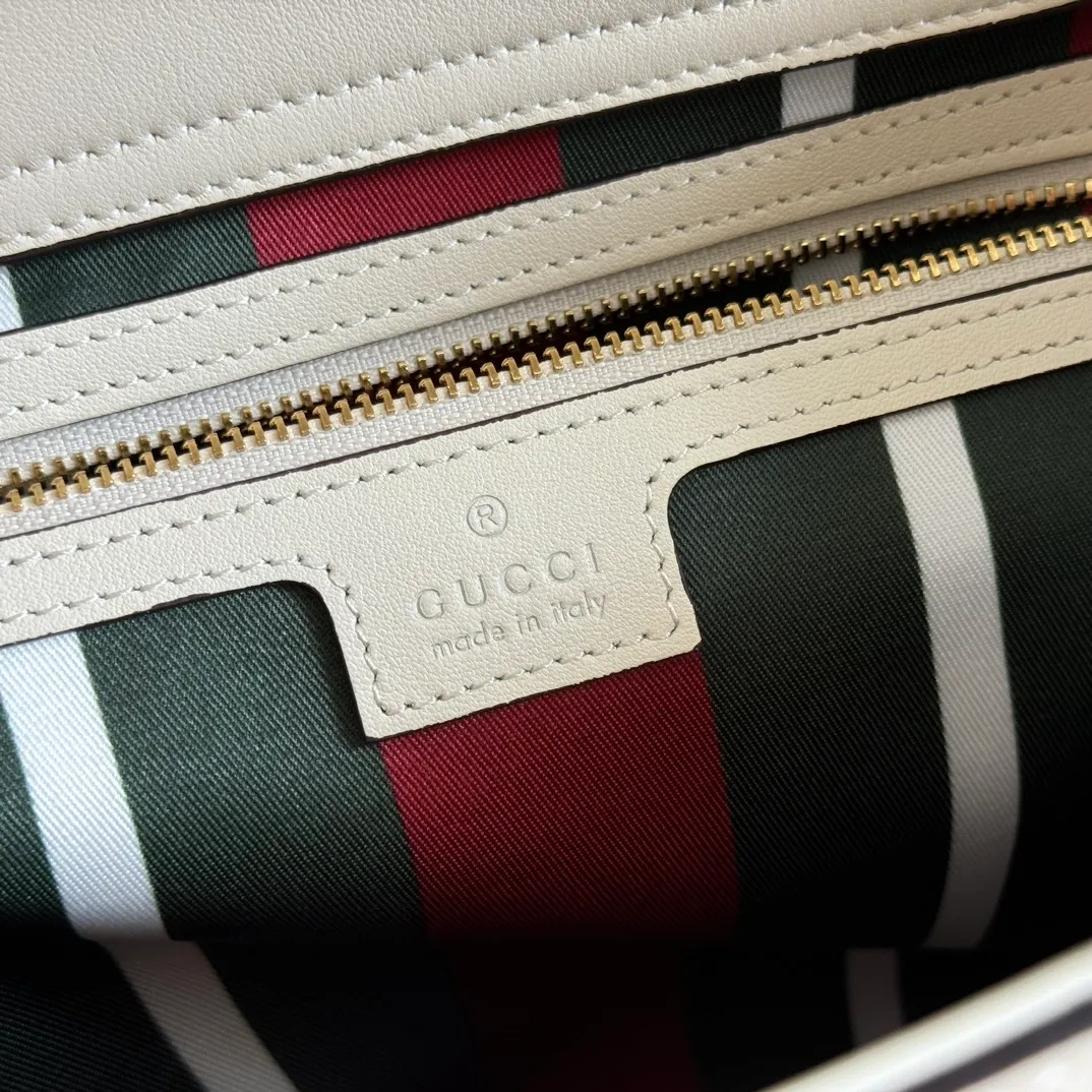 p1160. 💋💋💋Original leather [equipped with full counter packaging] The Padlock series has launched a variety of fashionable bags with various carrying methods, adding color to the 2025 early autumn series. This tote is lined with webbing, reminiscent of the brand's signature pattern. Black and dark brown GG monogram coated fabric Black leather trim Light gold tone hardware Red and green webbing cotton lining Interior: One zip pocket Carry handle (17.5 cm height) Removable and adjustable leather strap (height: 54 cm - 60 cm; length: 115 cm - 125 cm) Padlock closure with leather keychain Ident.: 838991. Dimensions: 31cm (width) x 21cm (height) x 11cm (thickness) Weight: approx. 0.8kg. Color: brown white PVC. Made in Italy