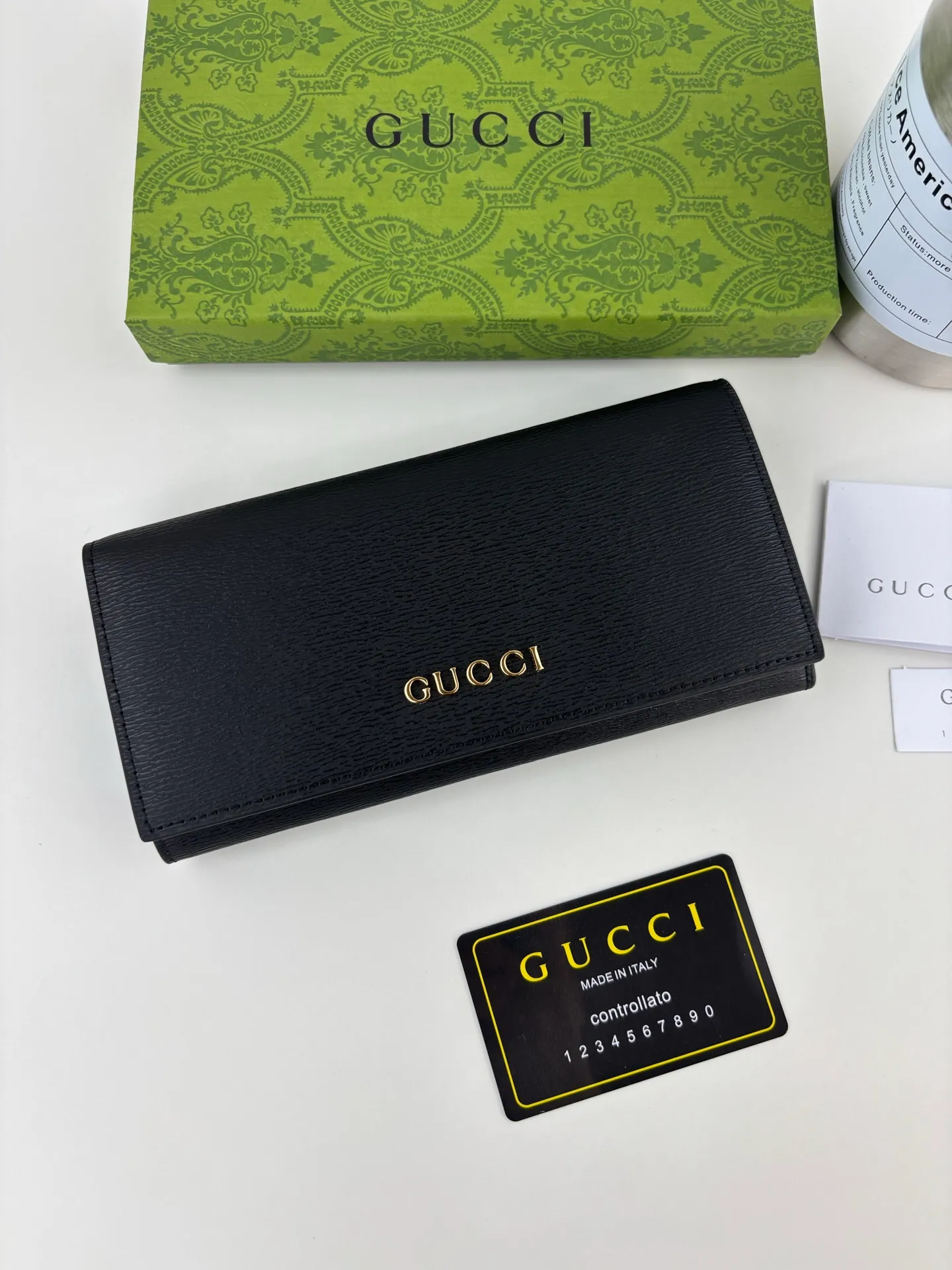 💰170 GUCCl long clip wallet with handwritten Gucci logo. Exploring self-expression with unlimited possibilities has become the spiritual connotation of brand design. Crafted from black leather, this long clip is embellished with a gold-toned handwritten Gucci logo-shaped hardware, adding a touch of the brand's signature charm to the entire design. Black leather, gold-tone hardware, taffeta lining, script Gucci logo detail. Interior: Twelve card compartments, two bill compartments, two separate internal compartments and a zippered coin pocket, this classic piece features snap fastening Style number: 772638 Dimensions: 19cm x 10cm x 3.5cm Colour: Black