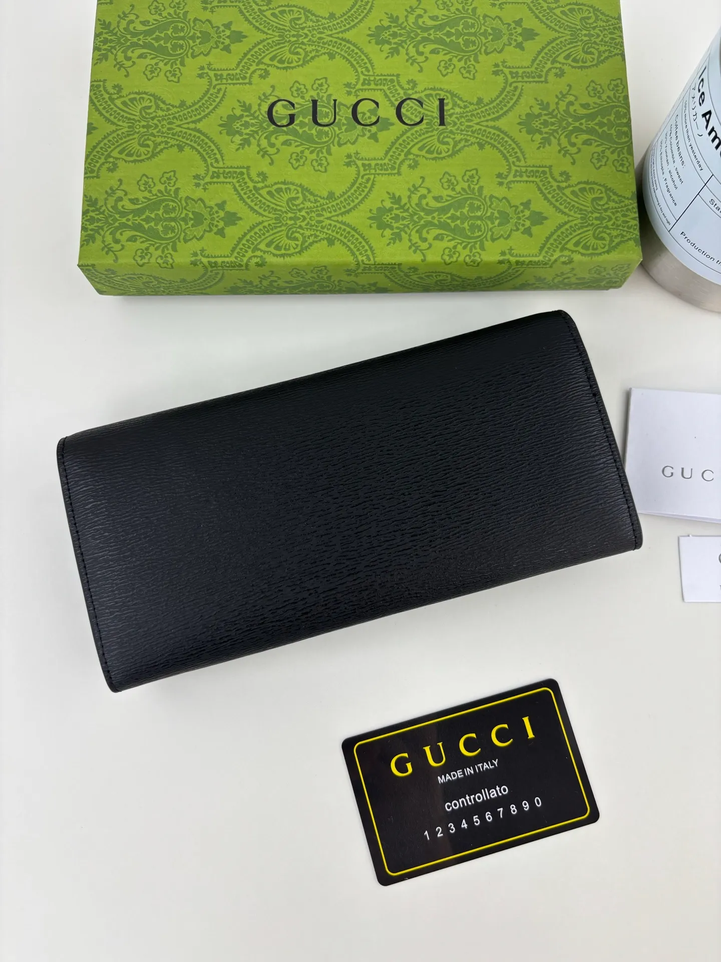 💰170 GUCCl long clip wallet with handwritten Gucci logo. Exploring self-expression with unlimited possibilities has become the spiritual connotation of brand design. Crafted from black leather, this long clip is embellished with a gold-toned handwritten Gucci logo-shaped hardware, adding a touch of the brand's signature charm to the entire design. Black leather, gold-tone hardware, taffeta lining, script Gucci logo detail. Interior: Twelve card compartments, two bill compartments, two separate internal compartments and a zippered coin pocket, this classic piece features snap fastening Style number: 772638 Dimensions: 19cm x 10cm x 3.5cm Colour: Black