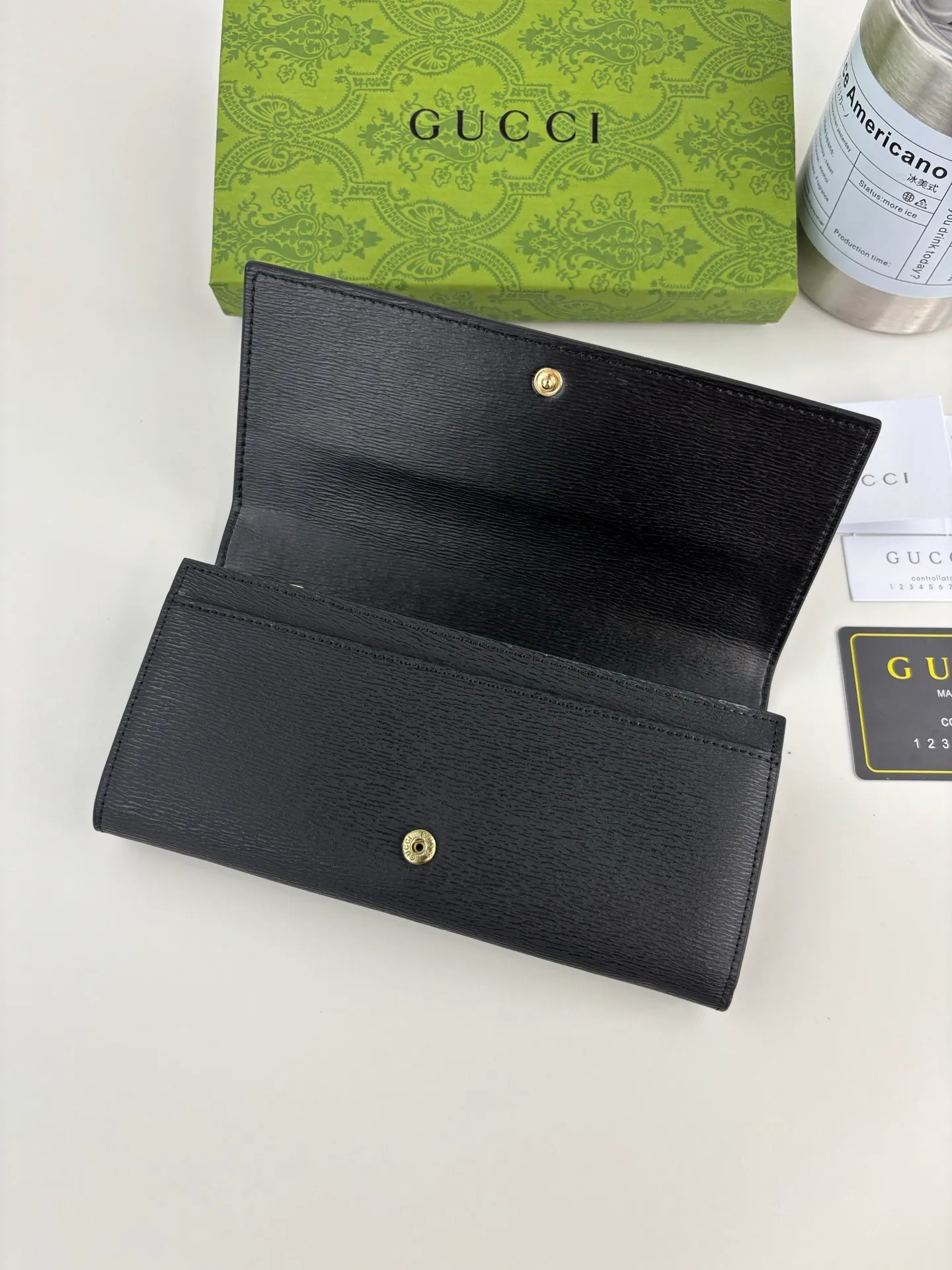 💰170 GUCCl long clip wallet with handwritten Gucci logo. Exploring self-expression with unlimited possibilities has become the spiritual connotation of brand design. Crafted from black leather, this long clip is embellished with a gold-toned handwritten Gucci logo-shaped hardware, adding a touch of the brand's signature charm to the entire design. Black leather, gold-tone hardware, taffeta lining, script Gucci logo detail. Interior: Twelve card compartments, two bill compartments, two separate internal compartments and a zippered coin pocket, this classic piece features snap fastening Style number: 772638 Dimensions: 19cm x 10cm x 3.5cm Colour: Black