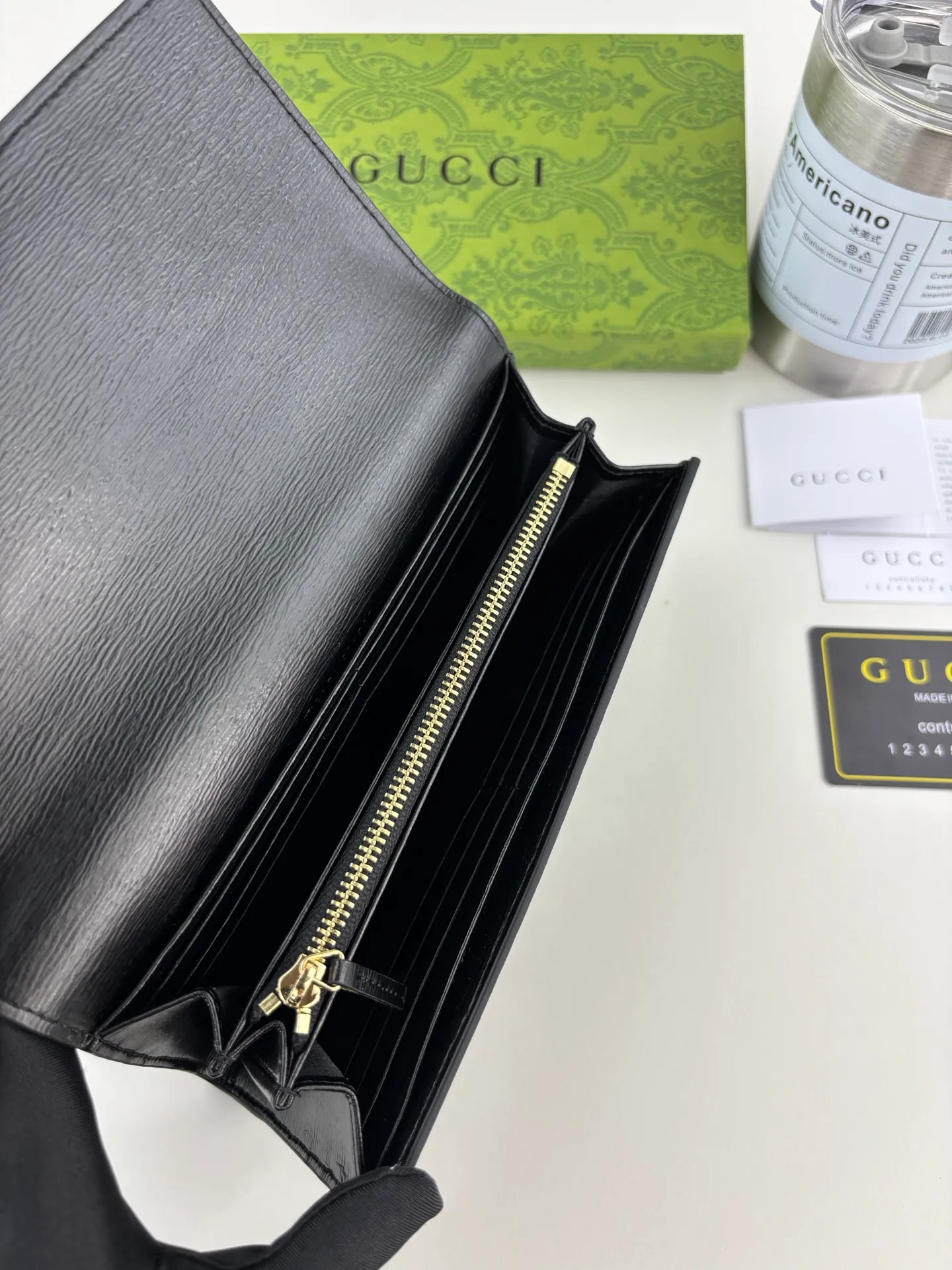 💰170 GUCCl long clip wallet with handwritten Gucci logo. Exploring self-expression with unlimited possibilities has become the spiritual connotation of brand design. Crafted from black leather, this long clip is embellished with a gold-toned handwritten Gucci logo-shaped hardware, adding a touch of the brand's signature charm to the entire design. Black leather, gold-tone hardware, taffeta lining, script Gucci logo detail. Interior: Twelve card compartments, two bill compartments, two separate internal compartments and a zippered coin pocket, this classic piece features snap fastening Style number: 772638 Dimensions: 19cm x 10cm x 3.5cm Colour: Black