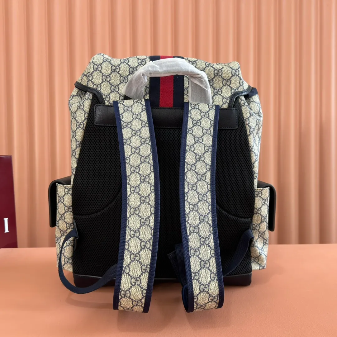 p1280. 🔥🔥🔥【With full set of original green gift bag】Ophidia series medium GG backpack. The 2024 early spring series renews the Ophidia series shoulder bags, tote bags and handbags in black GG denim, and the silver-toned accessories present a contrasting metallic texture. This Ophidia backpack in blue and black GG Supreme canvas demonstrates Gucci's design prowess in infusing the brand's iconic design elements with a modern appeal. Blue and black GG Supreme canvas, black leather piping, palladium tone hardware, cotton and linen blend lining, black mesh Double G on the back, flap side pockets with magnetic closure, inner phone pocket and padded tablet sleeve, adjustable shoulder strap, black mesh back, drawstring flap design, leather buckle fastening strap and extra magnetic buckle for easy opening and closing, weight: approx. 1.272 kg. Model: 598140. Dimensions: 40(length) x 24(width) x 16cm(thickness) Color: blue/pvc. Made in Italy