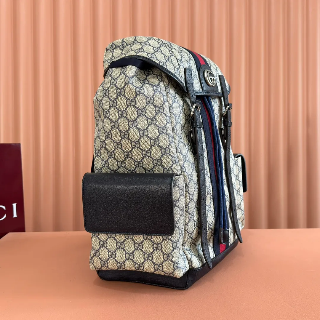 p1280. 🔥🔥🔥【With full set of original green gift bag】Ophidia series medium GG backpack. The 2024 early spring series renews the Ophidia series shoulder bags, tote bags and handbags in black GG denim, and the silver-toned accessories present a contrasting metallic texture. This Ophidia backpack in blue and black GG Supreme canvas demonstrates Gucci's design prowess in infusing the brand's iconic design elements with a modern appeal. Blue and black GG Supreme canvas, black leather piping, palladium tone hardware, cotton and linen blend lining, black mesh Double G on the back, flap side pockets with magnetic closure, inner phone pocket and padded tablet sleeve, adjustable shoulder strap, black mesh back, drawstring flap design, leather buckle fastening strap and extra magnetic buckle for easy opening and closing, weight: approx. 1.272 kg. Model: 598140. Dimensions: 40(length) x 24(width) x 16cm(thickness) Color: blue/pvc. Made in Italy