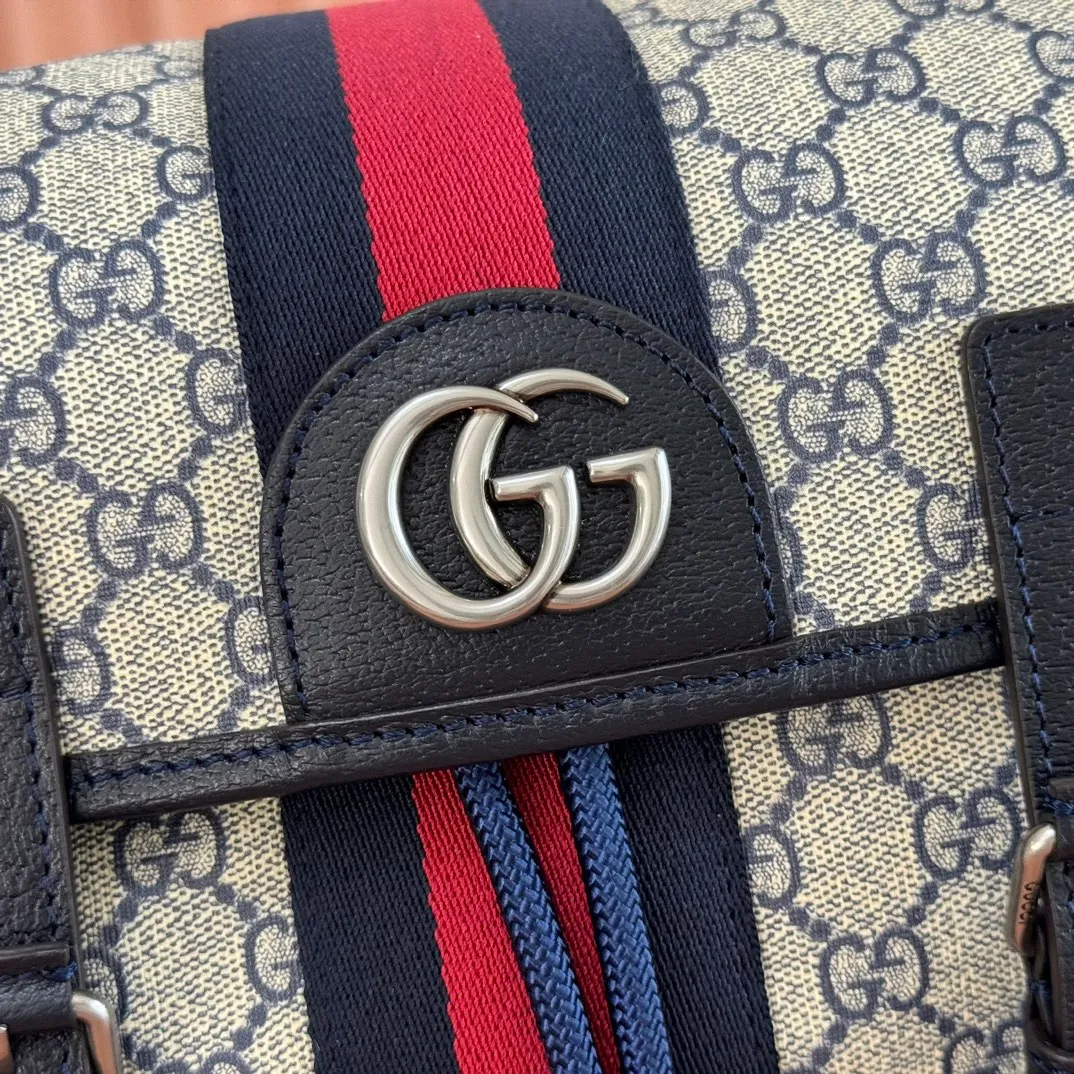p1280. 🔥🔥🔥【With full set of original green gift bag】Ophidia series medium GG backpack. The 2024 early spring series renews the Ophidia series shoulder bags, tote bags and handbags in black GG denim, and the silver-toned accessories present a contrasting metallic texture. This Ophidia backpack in blue and black GG Supreme canvas demonstrates Gucci's design prowess in infusing the brand's iconic design elements with a modern appeal. Blue and black GG Supreme canvas, black leather piping, palladium tone hardware, cotton and linen blend lining, black mesh Double G on the back, flap side pockets with magnetic closure, inner phone pocket and padded tablet sleeve, adjustable shoulder strap, black mesh back, drawstring flap design, leather buckle fastening strap and extra magnetic buckle for easy opening and closing, weight: approx. 1.272 kg. Model: 598140. Dimensions: 40(length) x 24(width) x 16cm(thickness) Color: blue/pvc. Made in Italy