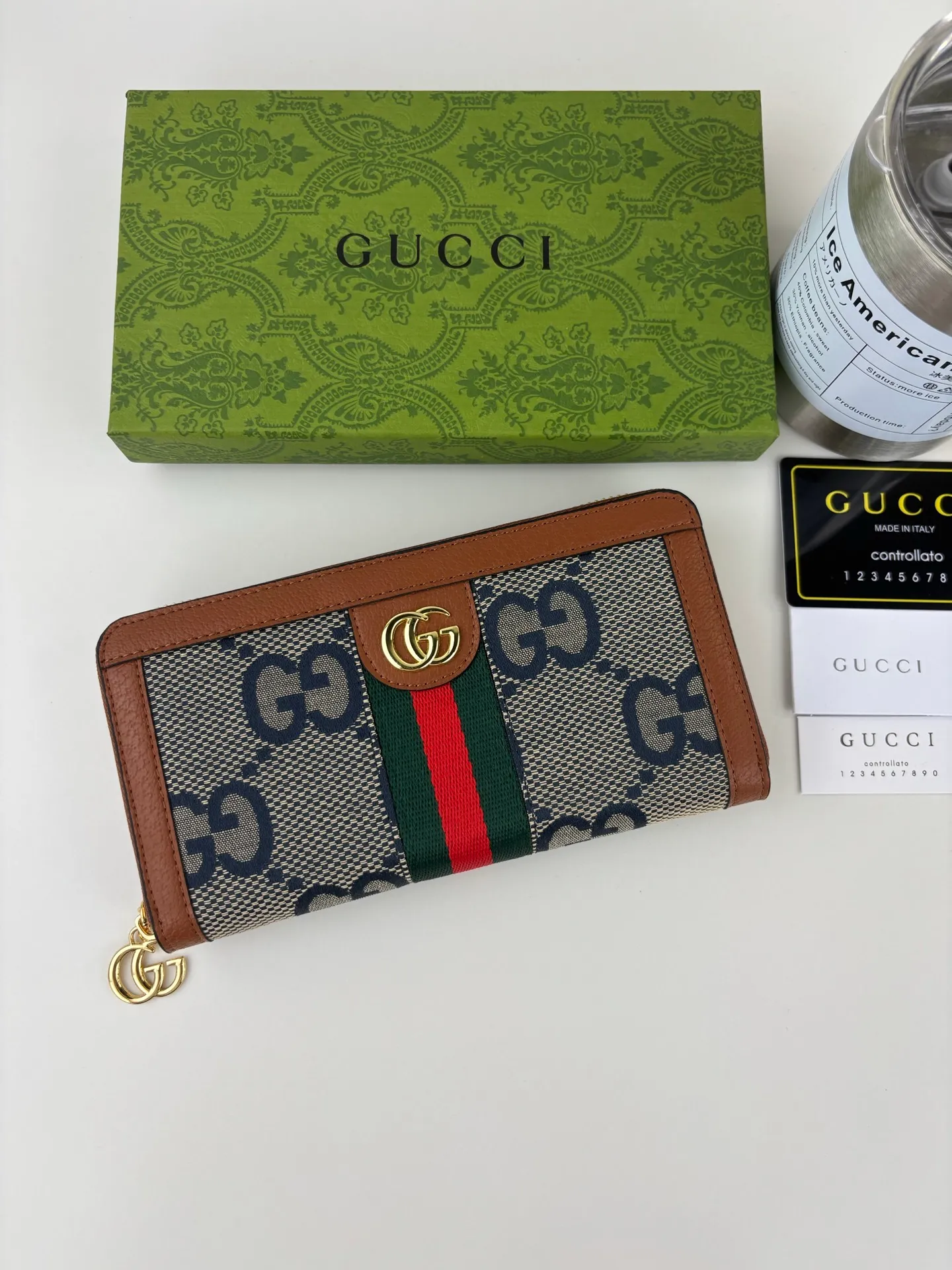 💰170 GUCCl full zipper wallet. The GG logo, which began to be used in the 1970s, evolved from the early Gucci diamond pattern that began in the 1930s. This full-zip wallet combines iconic graphics with striped webbing, a timeless combination that pays homage to Gucci's roots. Brown/ebony GG Supreme canvas with brown leather trim, gold-toned hardware Double G, 12 card compartments, 3 bill compartments, zipped coin pocket, full zip closure. Style number: 523154 Size: 19cm x 10cm x 2.5cm Color: blue small G/brown on cloth