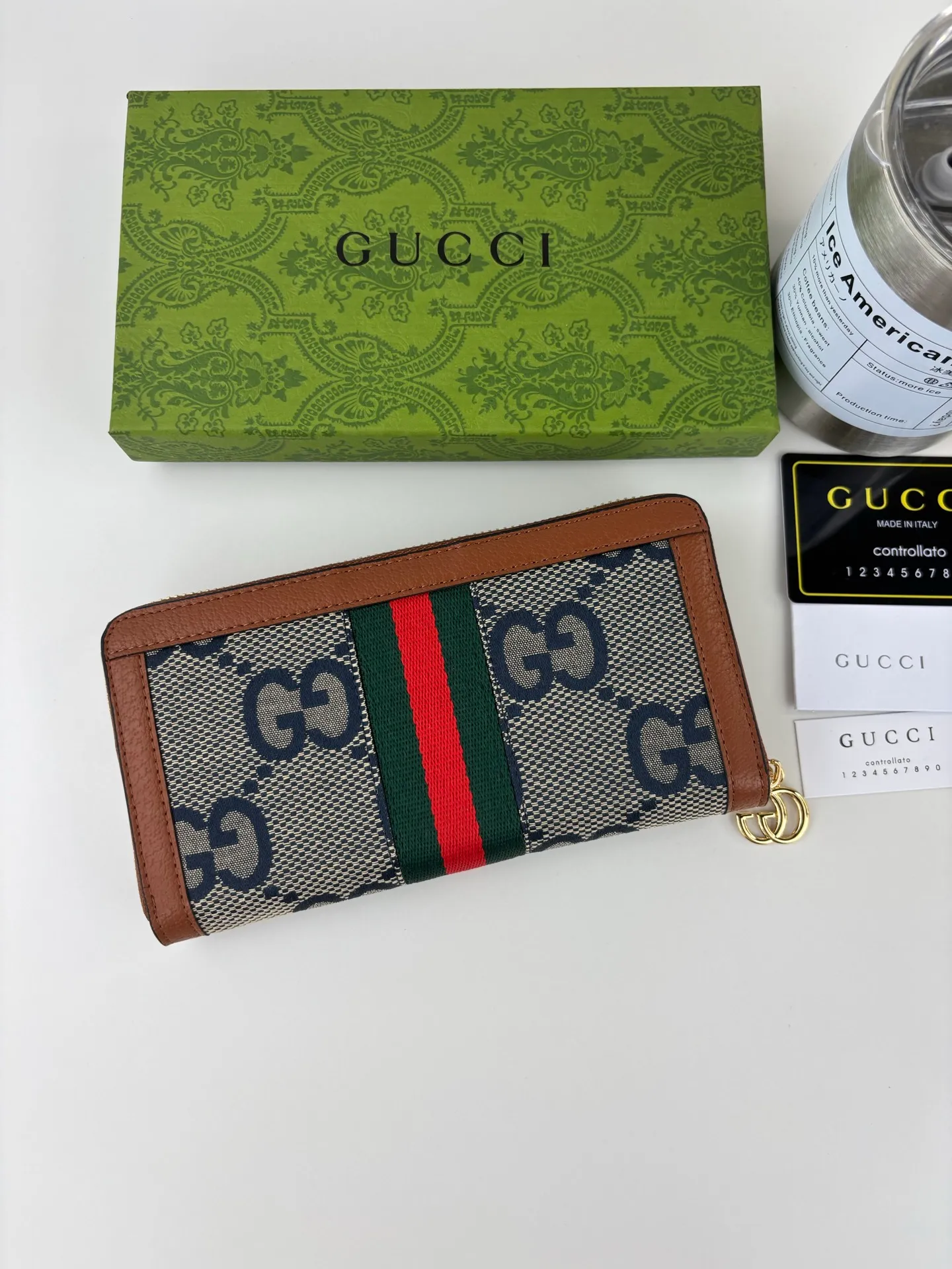 💰170 GUCCl full zipper wallet. The GG logo, which began to be used in the 1970s, evolved from the early Gucci diamond pattern that began in the 1930s. This full-zip wallet combines iconic graphics with striped webbing, a timeless combination that pays homage to Gucci's roots. Brown/ebony GG Supreme canvas with brown leather trim, gold-toned hardware Double G, 12 card compartments, 3 bill compartments, zipped coin pocket, full zip closure. Style number: 523154 Size: 19cm x 10cm x 2.5cm Color: blue small G/brown on cloth