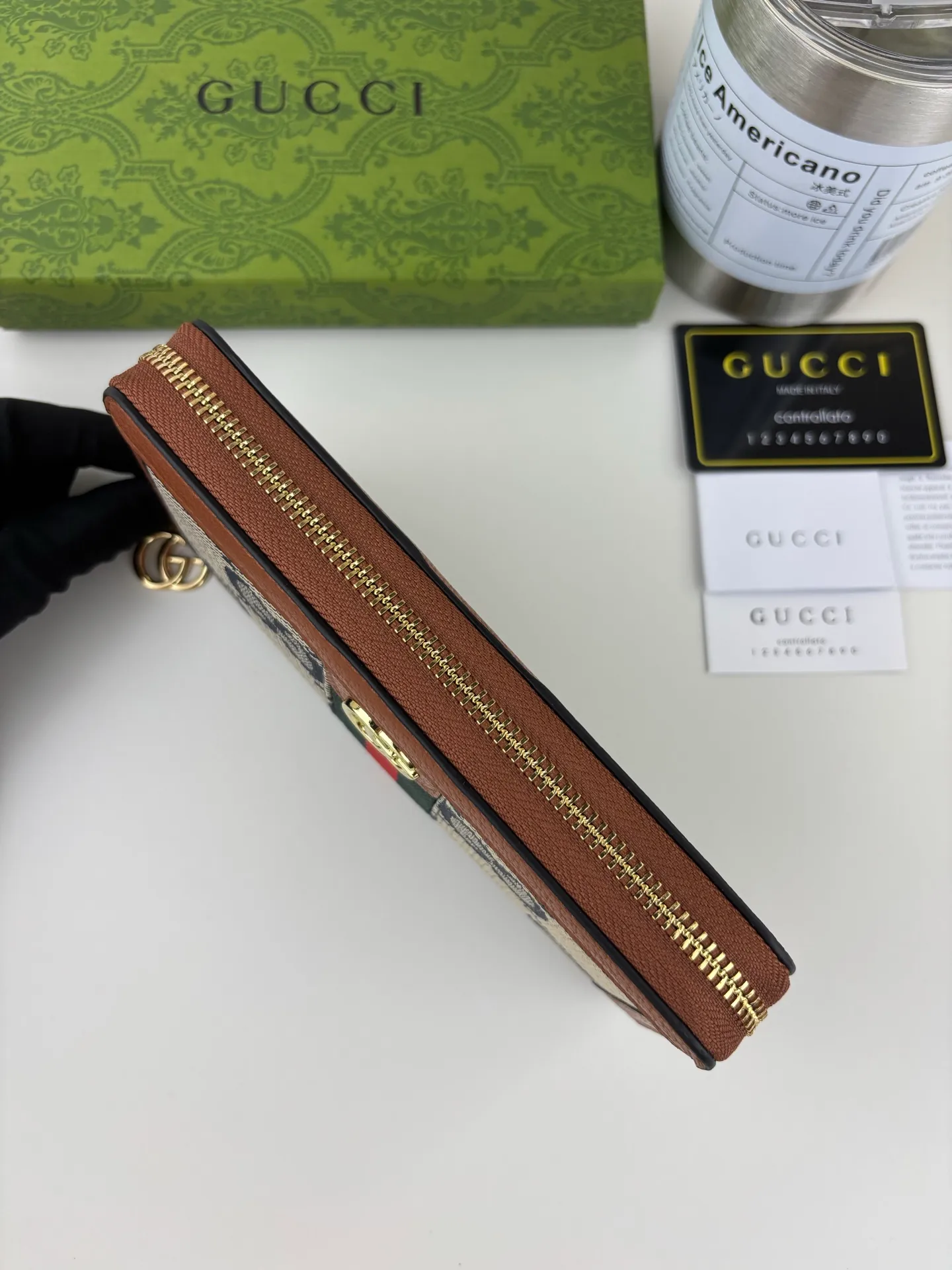 💰170 GUCCl full zipper wallet. The GG logo, which began to be used in the 1970s, evolved from the early Gucci diamond pattern that began in the 1930s. This full-zip wallet combines iconic graphics with striped webbing, a timeless combination that pays homage to Gucci's roots. Brown/ebony GG Supreme canvas with brown leather trim, gold-toned hardware Double G, 12 card compartments, 3 bill compartments, zipped coin pocket, full zip closure. Style number: 523154 Size: 19cm x 10cm x 2.5cm Color: blue small G/brown on cloth