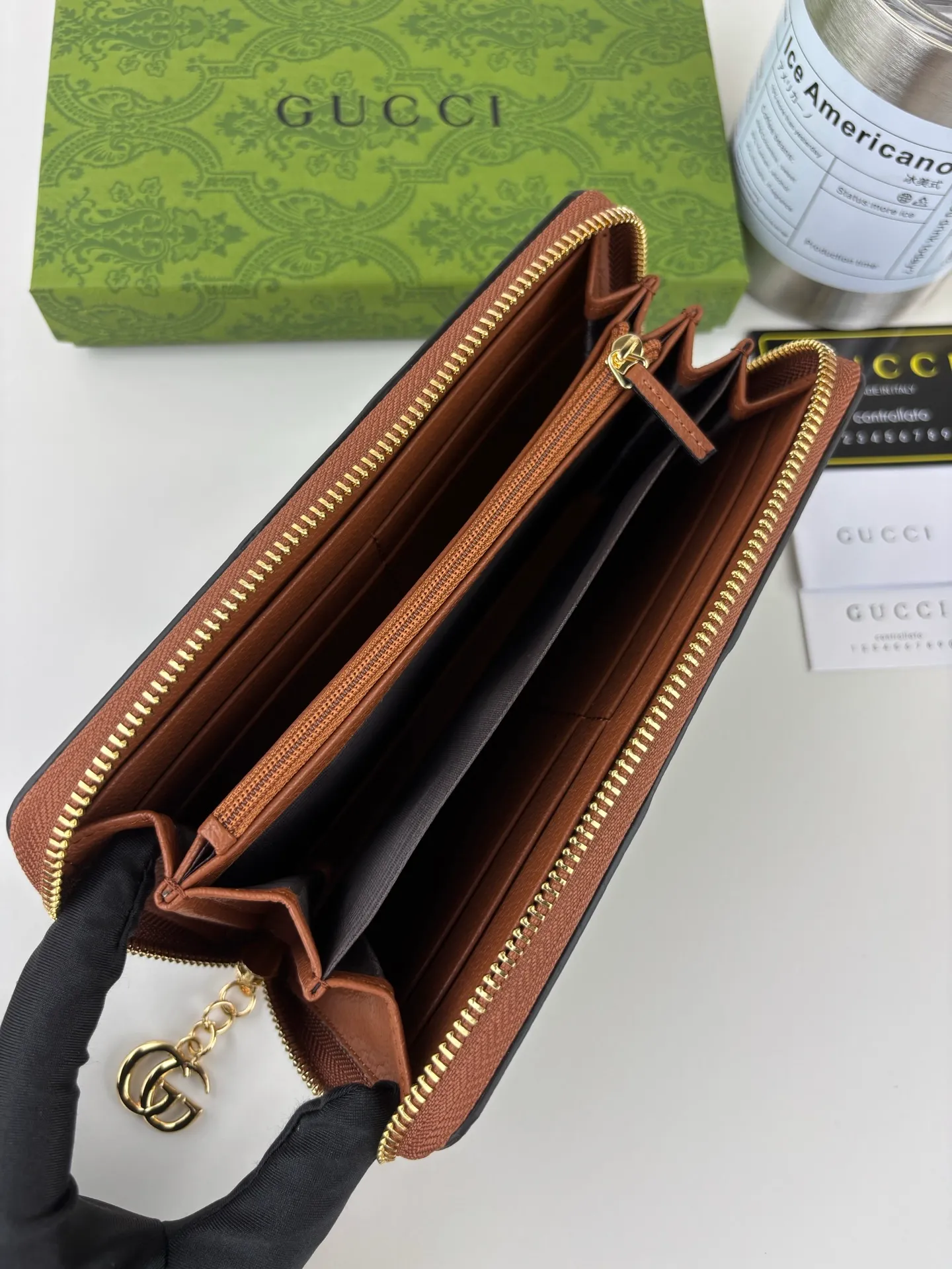 💰170 GUCCl full zipper wallet. The GG logo, which began to be used in the 1970s, evolved from the early Gucci diamond pattern that began in the 1930s. This full-zip wallet combines iconic graphics with striped webbing, a timeless combination that pays homage to Gucci's roots. Brown/ebony GG Supreme canvas with brown leather trim, gold-toned hardware Double G, 12 card compartments, 3 bill compartments, zipped coin pocket, full zip closure. Style number: 523154 Size: 19cm x 10cm x 2.5cm Color: blue small G/brown on cloth