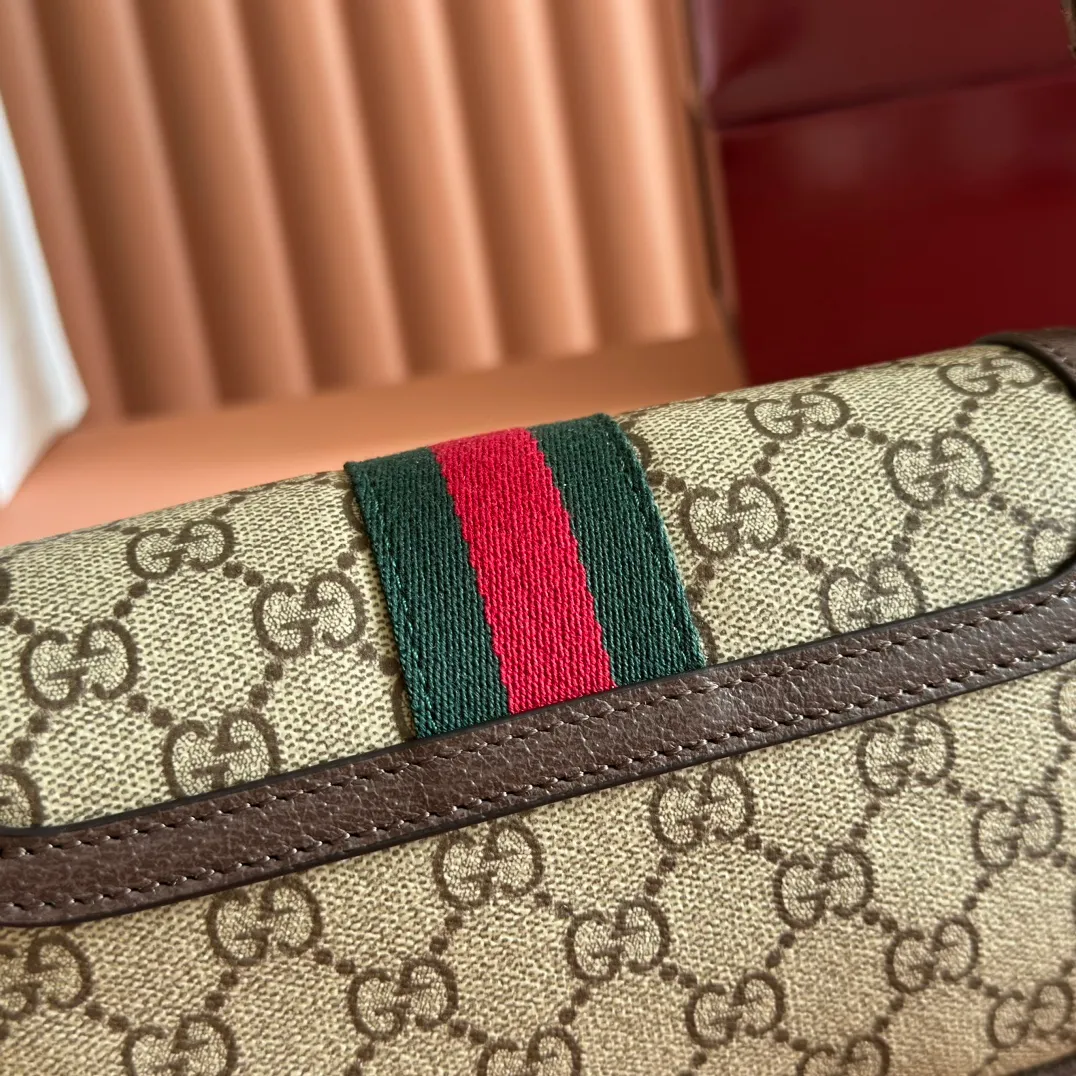 p960. 💋💋💋"With full set of original counter packaging" [New Product] The Ophidia series ingeniously interprets novel silhouettes and functions, with iconic beige and brown colors, creating a bag with soft texture and fashionable style. The flap is trimmed with signature webbing. Beige and dark brown GG monogram coated fabric Brown leather trim Light gold tone hardware Green linen cotton blend lining Double G Web strap Interior: Two card compartments Adjustable leather shoulder strap Height: 50 cm Magnetic snap closure Ident.: 838471. Dimensions: 19.5cm (width) x 11cm (height) x 6cm (depth) Weight: approx. 240g Color: Brown/PVC. Made in Italy