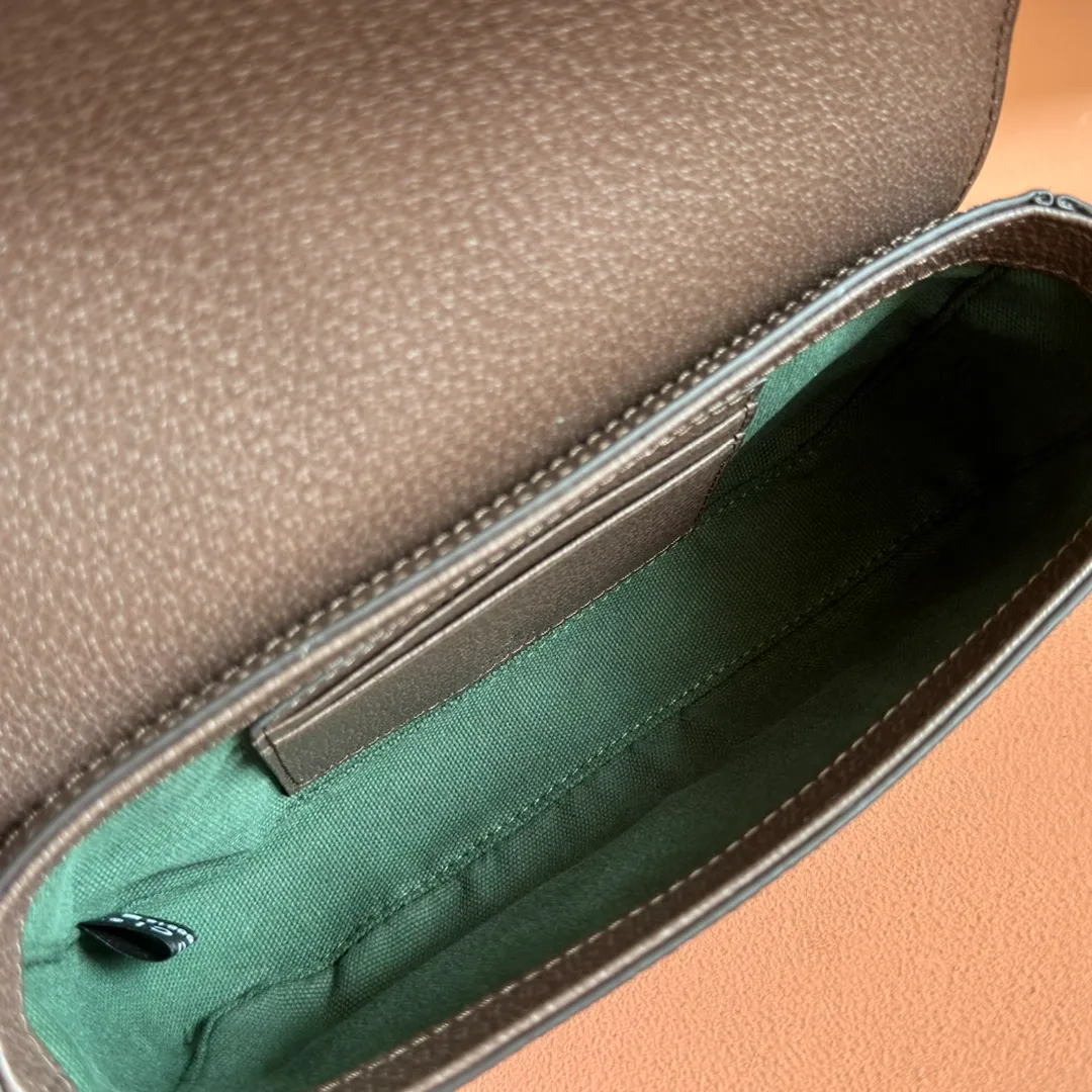 p960. 💋💋💋"With full set of original counter packaging" [New Product] The Ophidia series ingeniously interprets novel silhouettes and functions, with iconic beige and brown colors, creating a bag with soft texture and fashionable style. The flap is trimmed with signature webbing. Beige and dark brown GG monogram coated fabric Brown leather trim Light gold tone hardware Green linen cotton blend lining Double G Web strap Interior: Two card compartments Adjustable leather shoulder strap Height: 50 cm Magnetic snap closure Ident.: 838471. Dimensions: 19.5cm (width) x 11cm (height) x 6cm (depth) Weight: approx. 240g Color: Brown/PVC. Made in Italy
