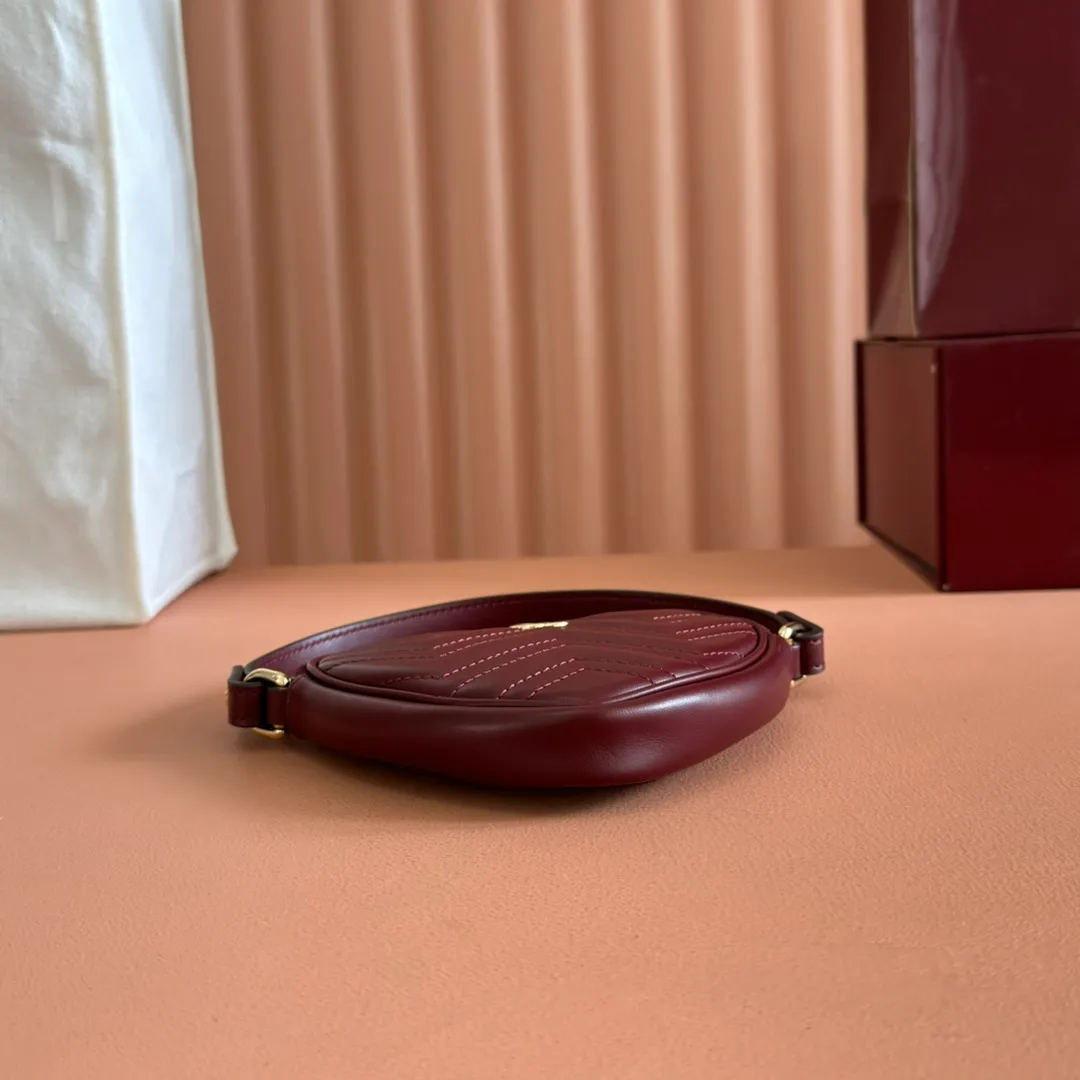 p940. 💋💋💋"With full set of original counter packaging" [New product] This GG Marmont series mini handbag has a playful and cute heart-shaped silhouette and is crafted from soft Gucci Ancola red V-shaped Matelassé cow leather. The bag has a simple and compact shape and is equipped with the iconic Double G accessories in light gold tones. Gucci Rosso Ancora red quilted V-shaped calfskin leather Light gold tone hardware Red taffeta lining Double G Interior: One card compartment Carry handle (8 cm height) Detachable and adjustable shoulder strap (48 cm height) Zip closure Weight: approx. 0.162 kg Ident number: 837753. Dimensions: 13.5cm (width) x 11.5cm (height) x 2.5cm (depth) Color: Red full leather. Made in Italy