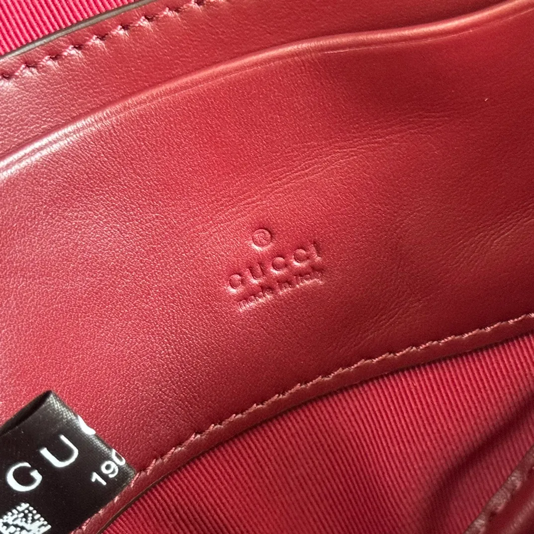 p940. 💋💋💋"With full set of original counter packaging" [New product] This GG Marmont series mini handbag has a playful and cute heart-shaped silhouette and is crafted from soft Gucci Ancola red V-shaped Matelassé cow leather. The bag has a simple and compact shape and is equipped with the iconic Double G accessories in light gold tones. Gucci Rosso Ancora red quilted V-shaped calfskin leather Light gold tone hardware Red taffeta lining Double G Interior: One card compartment Carry handle (8 cm height) Detachable and adjustable shoulder strap (48 cm height) Zip closure Weight: approx. 0.162 kg Ident number: 837753. Dimensions: 13.5cm (width) x 11.5cm (height) x 2.5cm (depth) Color: Red full leather. Made in Italy