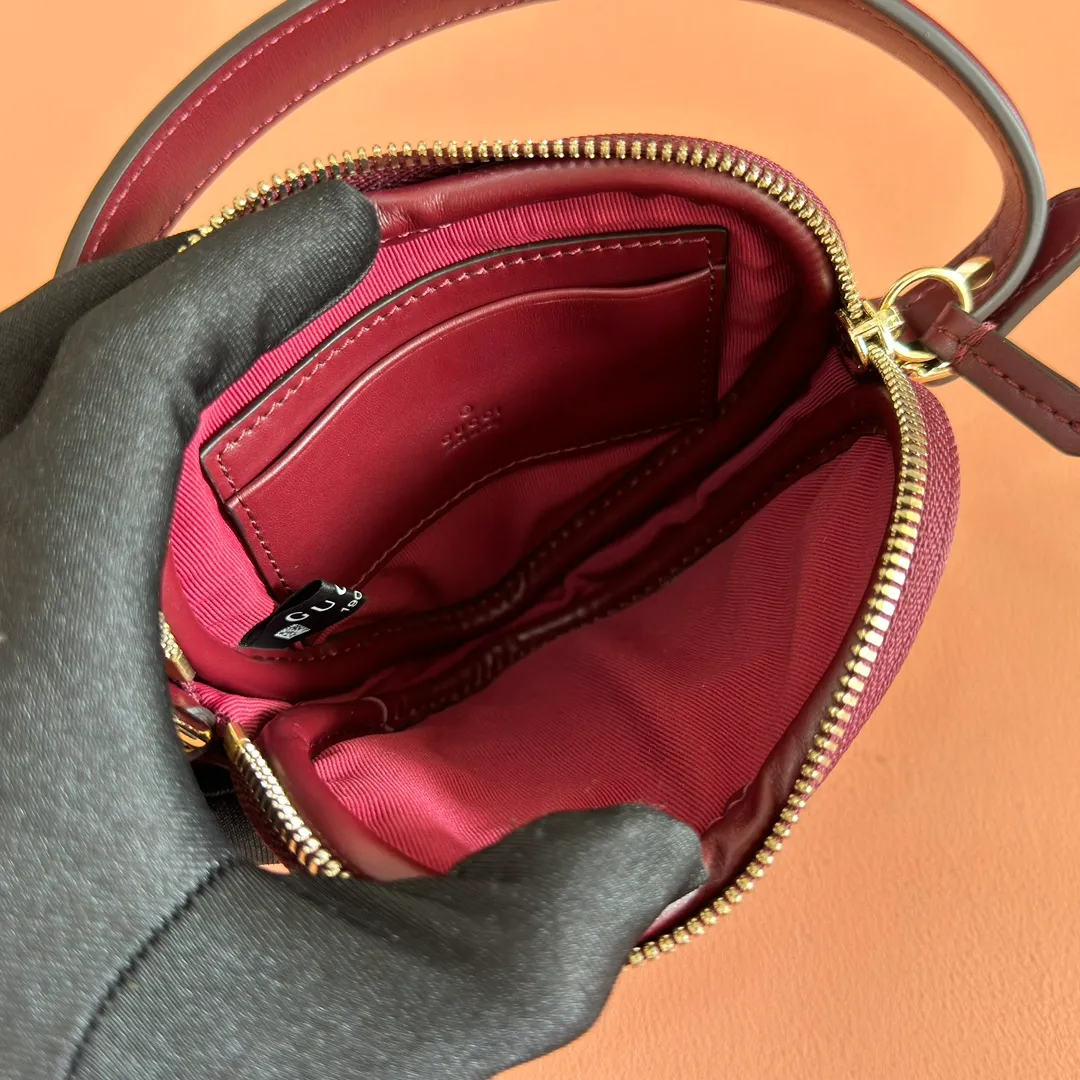 p940. 💋💋💋"With full set of original counter packaging" [New product] This GG Marmont series mini handbag has a playful and cute heart-shaped silhouette and is crafted from soft Gucci Ancola red V-shaped Matelassé cow leather. The bag has a simple and compact shape and is equipped with the iconic Double G accessories in light gold tones. Gucci Rosso Ancora red quilted V-shaped calfskin leather Light gold tone hardware Red taffeta lining Double G Interior: One card compartment Carry handle (8 cm height) Detachable and adjustable shoulder strap (48 cm height) Zip closure Weight: approx. 0.162 kg Ident number: 837753. Dimensions: 13.5cm (width) x 11.5cm (height) x 2.5cm (depth) Color: Red full leather. Made in Italy