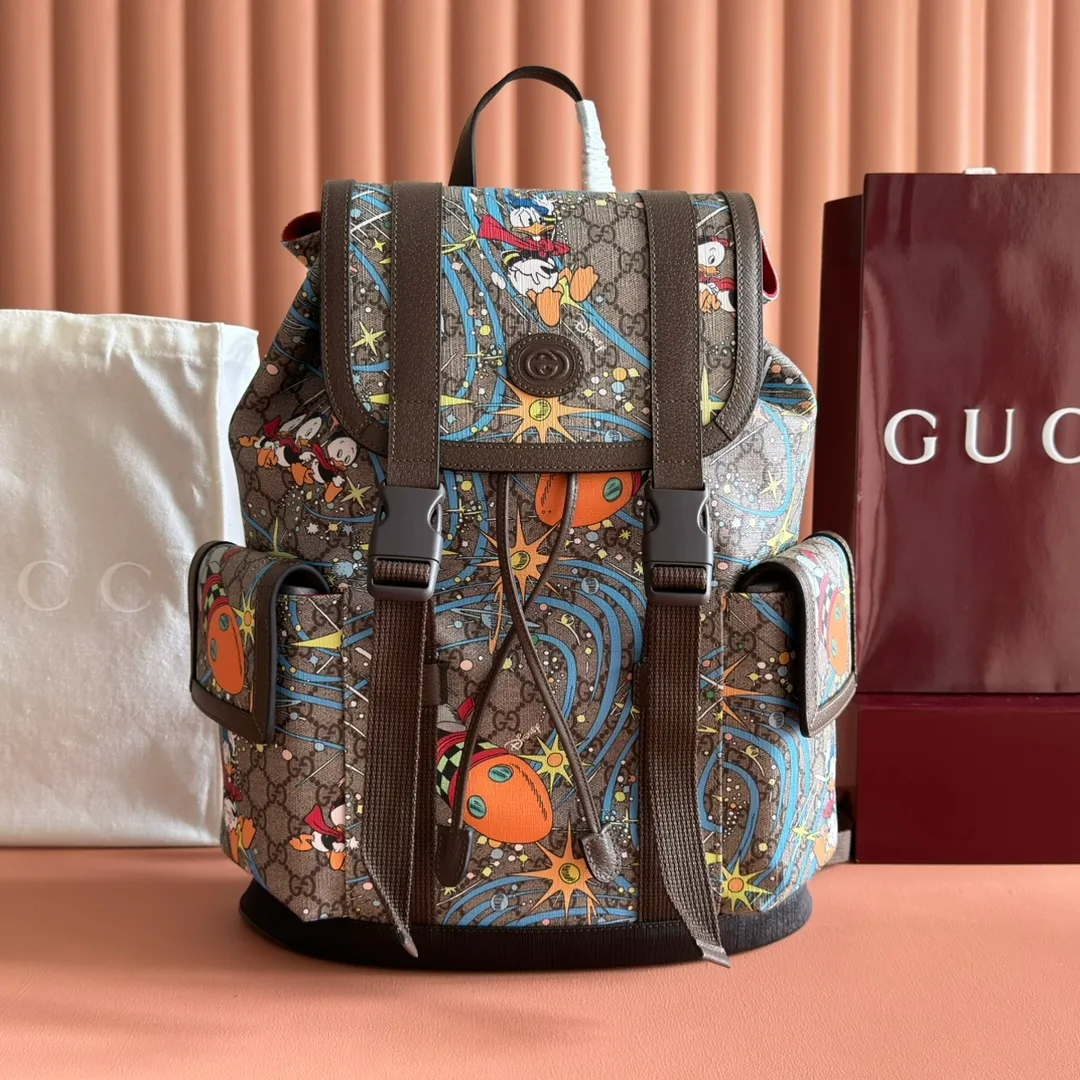 p1320. 📣📣📣【Original leather with full counter packaging】‼ ️G Home👉New style. The market's top exclusive goods control, special/counter quality 💯Using imported cowhide, original hardware! Exquisite workmanship. 💯Exclusive physical photos📷👉The quality can be seen in the picture👄👄😘😘. Style number: 645051. Dimensions: Width 34.5*Height 44*Side width 12.5. Color: Model: Brown PVC/Donald Duck