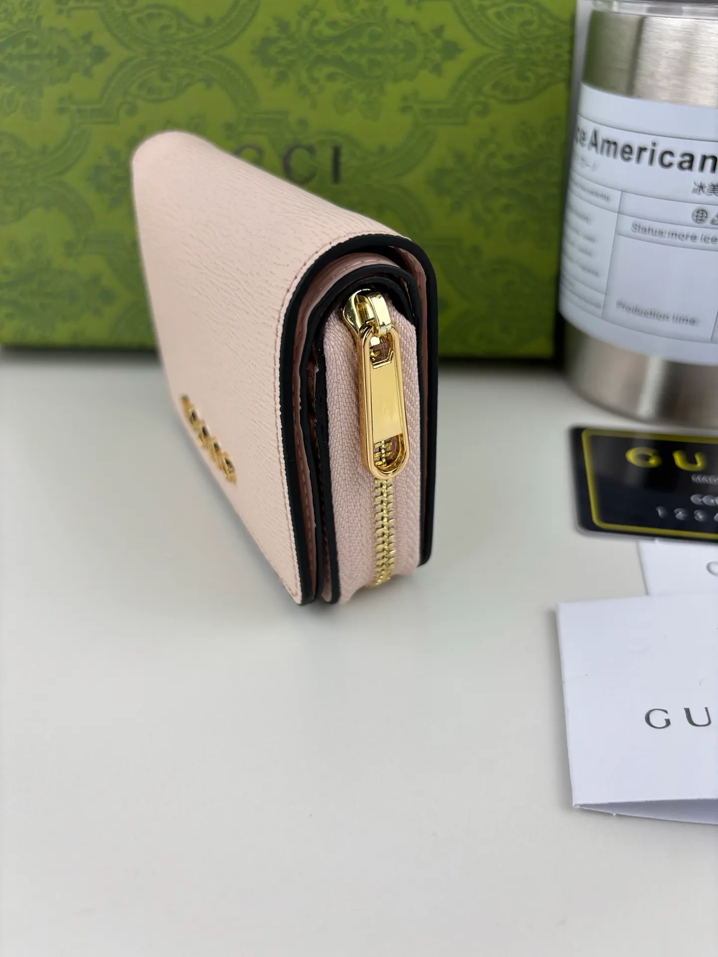 💰160 GUCCl chain wallet with handwritten Gucci logo. The small leather accessories series seamlessly integrates modern fashion elements to create ingenious items with changing styles without losing classic connotation, bringing fresh vitality to formal leather items. This chain wallet is crafted from pink leather and features the Gucci logo in gold-tone script. Pink leather, gold-tone hardware, taffeta lining, scripted Gucci logo detail, interior: six card compartments, one zipped gusset pocket and one open compartment, chain strap, snap button fastening. Style No.: 772639 Size: 9cmx 11cmx 2.5cm Color: Pink