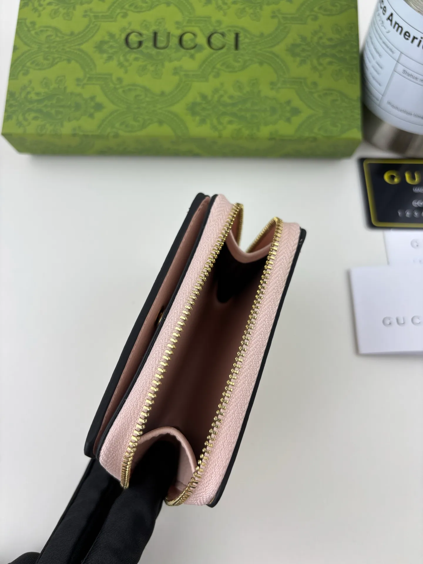 💰160 GUCCl chain wallet with handwritten Gucci logo. The small leather accessories series seamlessly integrates modern fashion elements to create ingenious items with changing styles without losing classic connotation, bringing fresh vitality to formal leather items. This chain wallet is crafted from pink leather and features the Gucci logo in gold-tone script. Pink leather, gold-tone hardware, taffeta lining, scripted Gucci logo detail, interior: six card compartments, one zipped gusset pocket and one open compartment, chain strap, snap button fastening. Style No.: 772639 Size: 9cmx 11cmx 2.5cm Color: Pink
