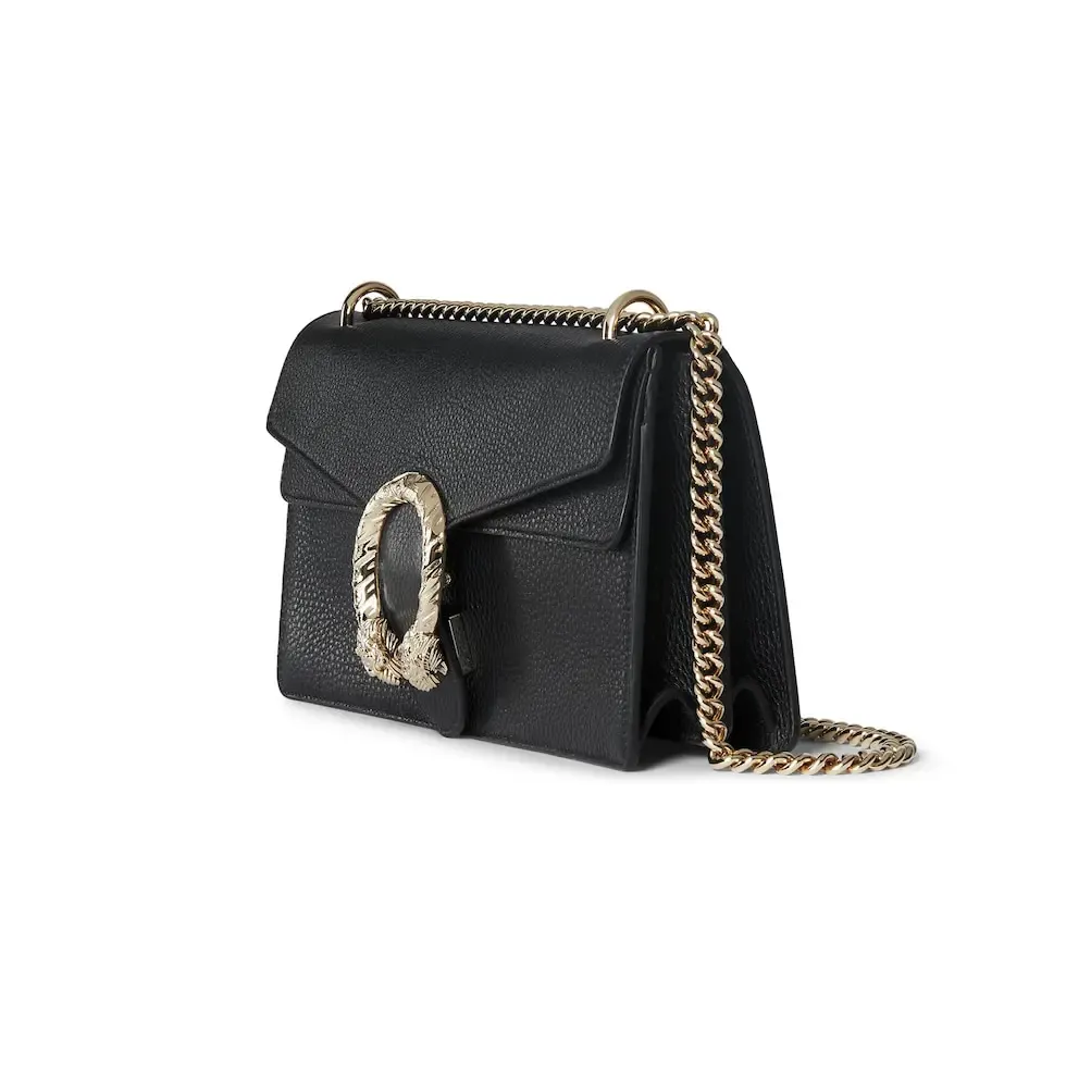 This piece is crafted from black leather, with double tiger head locks and a flip design. The length can be adjusted freely by sliding the chain to create different styles. Black leather Light gold-tone hardware Black microfiber lining Pin buckle, side opening Double tiger head lock closure Internal zip compartment Flap pocket Double baffles Sliding chain strap can be adjusted to a shoulder strap with a height of 43 cm, or a top handle with a height of 24 cm. Weight: about 0.8 kg Model: 795005. Dimensions: 28cm (width) x 16cm (height) x 10.5cm (depth) Color: Black Full leather: Original leather. Made in Italy