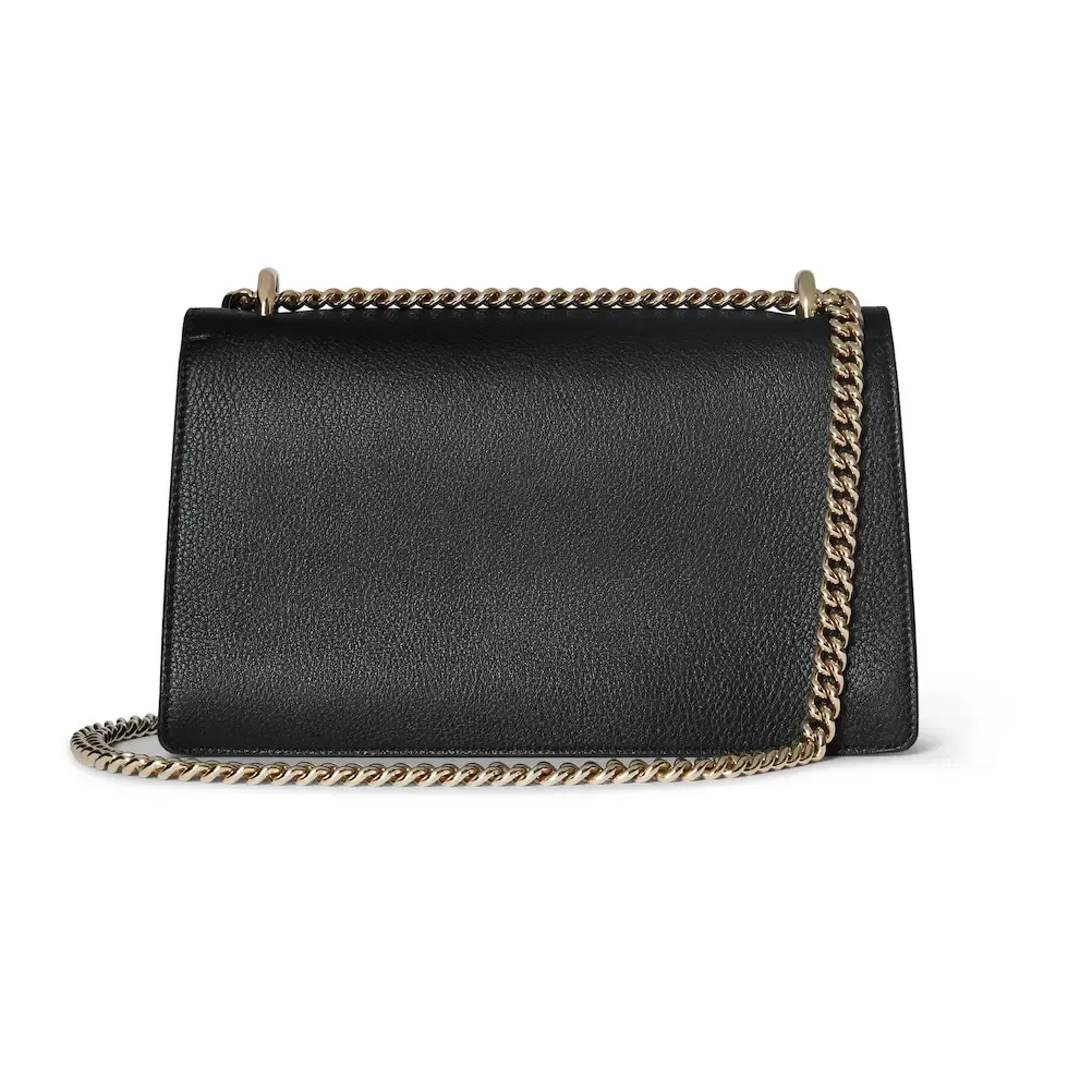 This piece is crafted from black leather, with double tiger head locks and a flip design. The length can be adjusted freely by sliding the chain to create different styles. Black leather Light gold-tone hardware Black microfiber lining Pin buckle, side opening Double tiger head lock closure Internal zip compartment Flap pocket Double baffles Sliding chain strap can be adjusted to a shoulder strap with a height of 43 cm, or a top handle with a height of 24 cm. Weight: about 0.8 kg Model: 795005. Dimensions: 28cm (width) x 16cm (height) x 10.5cm (depth) Color: Black Full leather: Original leather. Made in Italy