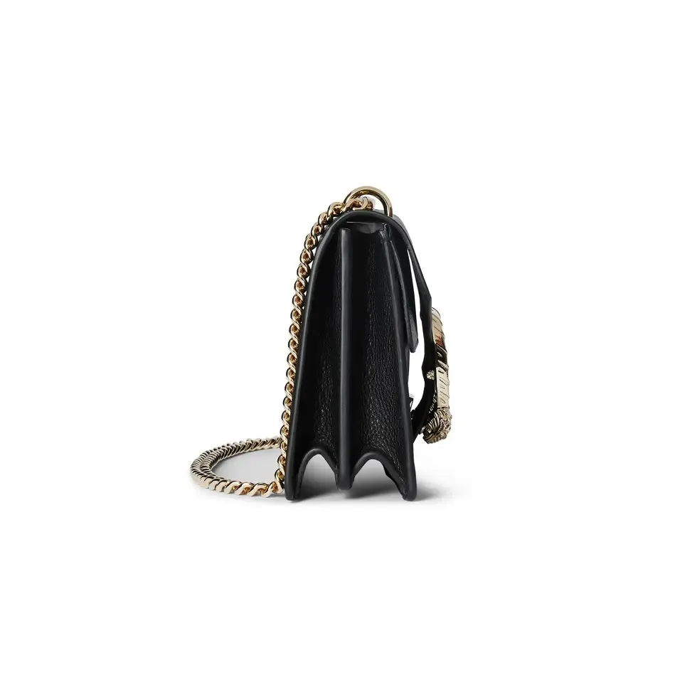 This piece is crafted from black leather, with double tiger head locks and a flip design. The length can be adjusted freely by sliding the chain to create different styles. Black leather Light gold-tone hardware Black microfiber lining Pin buckle, side opening Double tiger head lock closure Internal zip compartment Flap pocket Double baffles Sliding chain strap can be adjusted to a shoulder strap with a height of 43 cm, or a top handle with a height of 24 cm. Weight: about 0.8 kg Model: 795005. Dimensions: 28cm (width) x 16cm (height) x 10.5cm (depth) Color: Black Full leather: Original leather. Made in Italy