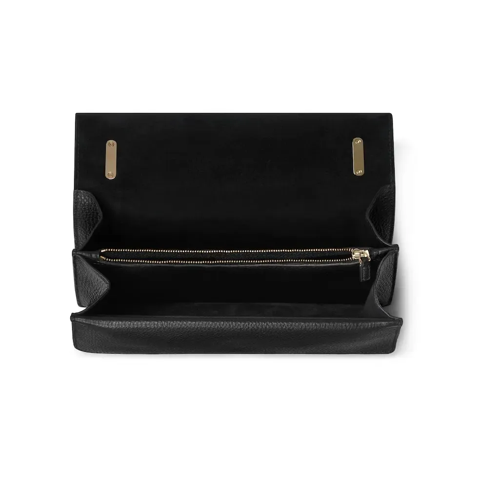 This piece is crafted from black leather, with double tiger head locks and a flip design. The length can be adjusted freely by sliding the chain to create different styles. Black leather Light gold-tone hardware Black microfiber lining Pin buckle, side opening Double tiger head lock closure Internal zip compartment Flap pocket Double baffles Sliding chain strap can be adjusted to a shoulder strap with a height of 43 cm, or a top handle with a height of 24 cm. Weight: about 0.8 kg Model: 795005. Dimensions: 28cm (width) x 16cm (height) x 10.5cm (depth) Color: Black Full leather: Original leather. Made in Italy