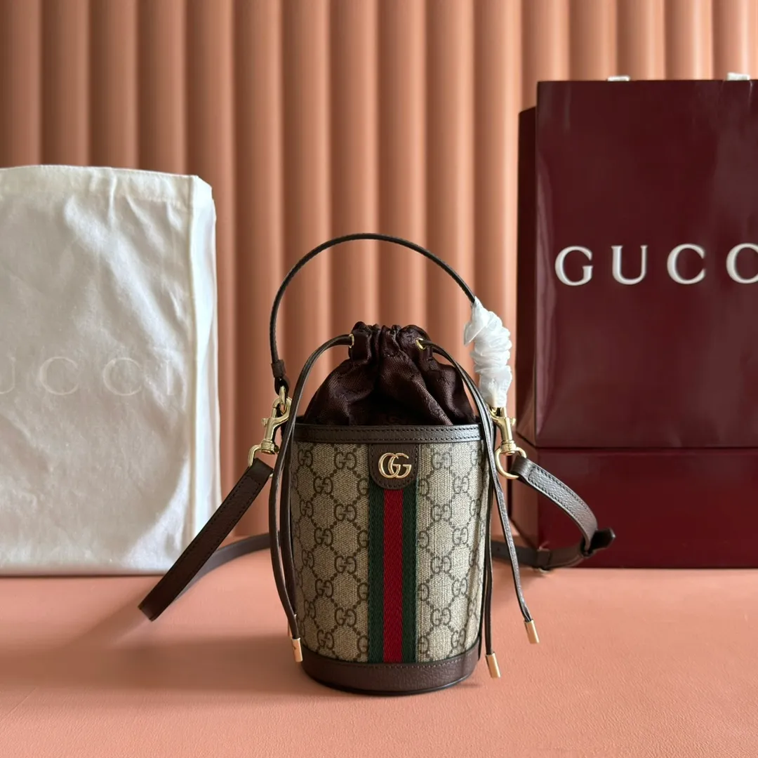 p1000💋💋💋"With full set of original counter packaging" [New Product] The Ophidia series ingeniously interprets novel silhouettes and functions, with iconic beige and brown colors, creating a bag with soft texture and fashionable style. This bucket bag features a top handle and a shoulder strap. Beige and dark brown GG monogram coated fabric Gucci Rosso Ancora leather trim Light gold tone hardware Gucci Ancora taffeta lining and green cotton linen lining Double G webbing handles (12 cm high) removable and adjustable leather shoulder strap (52 cm high) drawstring fly Ident: 838462. Dimensions: 11.5cm (width) x 23cm (height) x 8cm (depth) Weight: approx. 312g Color: brown/PVC. Made in Italy