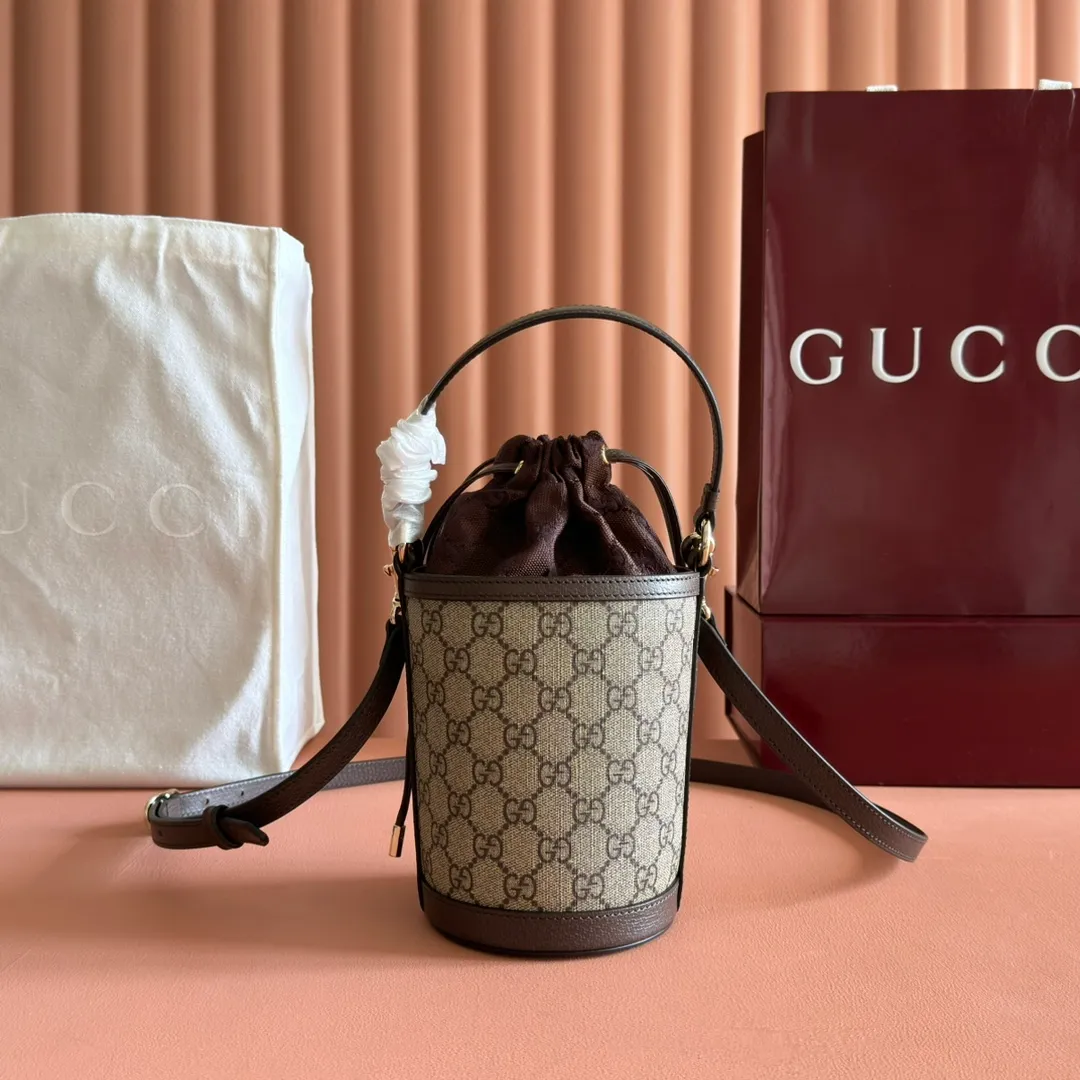 p1000💋💋💋"With full set of original counter packaging" [New Product] The Ophidia series ingeniously interprets novel silhouettes and functions, with iconic beige and brown colors, creating a bag with soft texture and fashionable style. This bucket bag features a top handle and a shoulder strap. Beige and dark brown GG monogram coated fabric Gucci Rosso Ancora leather trim Light gold tone hardware Gucci Ancora taffeta lining and green cotton linen lining Double G webbing handles (12 cm high) removable and adjustable leather shoulder strap (52 cm high) drawstring fly Ident: 838462. Dimensions: 11.5cm (width) x 23cm (height) x 8cm (depth) Weight: approx. 312g Color: brown/PVC. Made in Italy