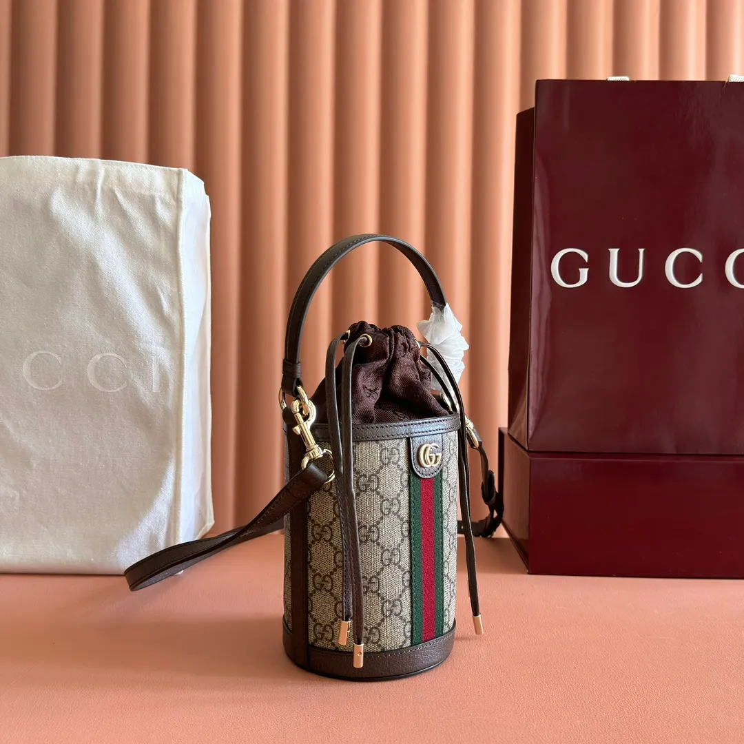 p1000💋💋💋"With full set of original counter packaging" [New Product] The Ophidia series ingeniously interprets novel silhouettes and functions, with iconic beige and brown colors, creating a bag with soft texture and fashionable style. This bucket bag features a top handle and a shoulder strap. Beige and dark brown GG monogram coated fabric Gucci Rosso Ancora leather trim Light gold tone hardware Gucci Ancora taffeta lining and green cotton linen lining Double G webbing handles (12 cm high) removable and adjustable leather shoulder strap (52 cm high) drawstring fly Ident: 838462. Dimensions: 11.5cm (width) x 23cm (height) x 8cm (depth) Weight: approx. 312g Color: brown/PVC. Made in Italy