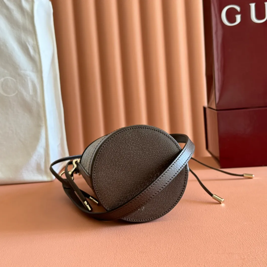 p1000💋💋💋"With full set of original counter packaging" [New Product] The Ophidia series ingeniously interprets novel silhouettes and functions, with iconic beige and brown colors, creating a bag with soft texture and fashionable style. This bucket bag features a top handle and a shoulder strap. Beige and dark brown GG monogram coated fabric Gucci Rosso Ancora leather trim Light gold tone hardware Gucci Ancora taffeta lining and green cotton linen lining Double G webbing handles (12 cm high) removable and adjustable leather shoulder strap (52 cm high) drawstring fly Ident: 838462. Dimensions: 11.5cm (width) x 23cm (height) x 8cm (depth) Weight: approx. 312g Color: brown/PVC. Made in Italy