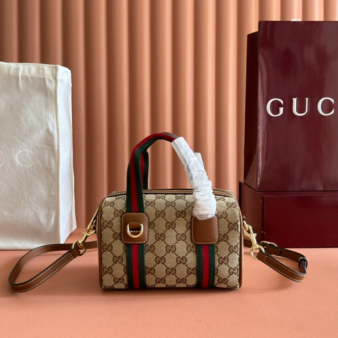 p960💋💋💋. "With full set of original counter packaging" [New Product] Inspired by Gucci's iconic travel bag silhouette, the brand launched the Mini GG handbag. This handbag is crafted from soft GG presbyopic canvas and is equipped with web handles and a detachable shoulder strap. It reinterprets the brand's classic elements and pays homage to Gucci's proud travel tradition. Beige and dark brown GG monogram coated fabric Ankara red leather trim Light gold tone hardware Green linen cotton blend lining Carry handles (10cm high) Detachable and adjustable leather shoulder strap (50cm high; Length: 101.5cm) Model number: 859975. Dimensions: 20cm (W) x 13cm (H) x 13cm (D) Weight: approx. 0.4kg Colour: Brown cloth/PVC. Made in Italy