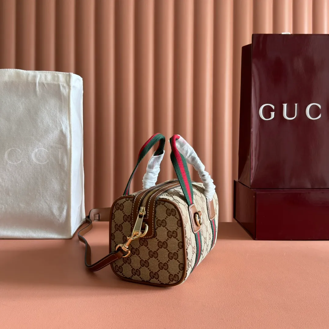 p960💋💋💋. "With full set of original counter packaging" [New Product] Inspired by Gucci's iconic travel bag silhouette, the brand launched the Mini GG handbag. This handbag is crafted from soft GG presbyopic canvas and is equipped with web handles and a detachable shoulder strap. It reinterprets the brand's classic elements and pays homage to Gucci's proud travel tradition. Beige and dark brown GG monogram coated fabric Ankara red leather trim Light gold tone hardware Green linen cotton blend lining Carry handles (10cm high) Detachable and adjustable leather shoulder strap (50cm high; Length: 101.5cm) Model number: 859975. Dimensions: 20cm (W) x 13cm (H) x 13cm (D) Weight: approx. 0.4kg Colour: Brown cloth/PVC. Made in Italy