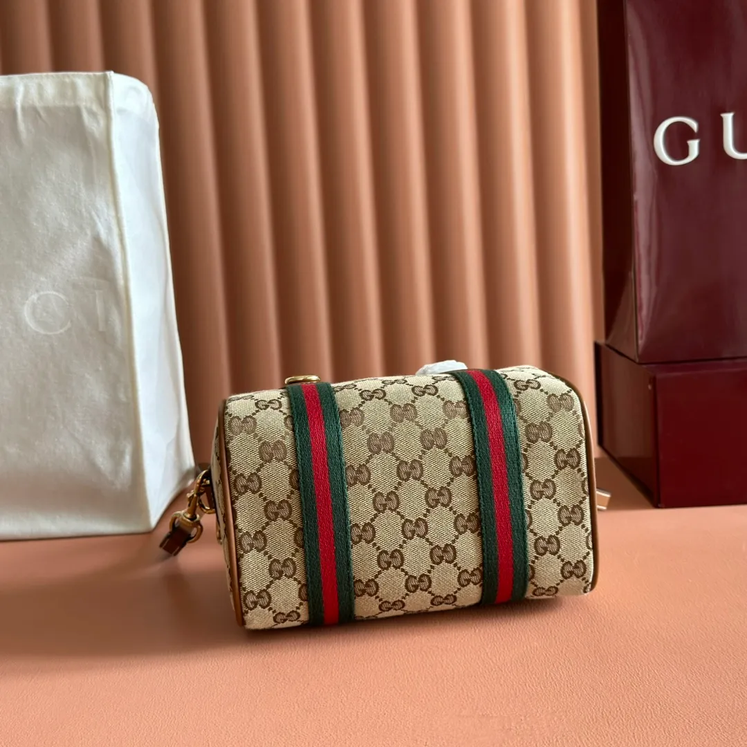 p960💋💋💋. "With full set of original counter packaging" [New Product] Inspired by Gucci's iconic travel bag silhouette, the brand launched the Mini GG handbag. This handbag is crafted from soft GG presbyopic canvas and is equipped with web handles and a detachable shoulder strap. It reinterprets the brand's classic elements and pays homage to Gucci's proud travel tradition. Beige and dark brown GG monogram coated fabric Ankara red leather trim Light gold tone hardware Green linen cotton blend lining Carry handles (10cm high) Detachable and adjustable leather shoulder strap (50cm high; Length: 101.5cm) Model number: 859975. Dimensions: 20cm (W) x 13cm (H) x 13cm (D) Weight: approx. 0.4kg Colour: Brown cloth/PVC. Made in Italy