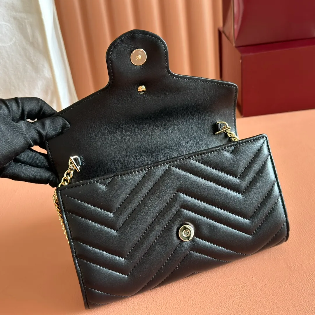 p760. 💋💋💋"With full set of original counter packaging" [New product] This GG Marmont series chain wallet is crafted with Matelassé cow leather. The series' iconic double G accessories make the entire design fuller. Black quilted V-shaped calfskin Leather Light gold-tone hardware Black taffeta lining Double G Interior: six card compartments, one zip pocket and one flap pocket Chain shoulder strap (60 cm high) Press-button closure Ident.: 837745. Dimensions: 20cm (width) x 12cm (height) x 4cm (depth) Weight: approx. 357g
