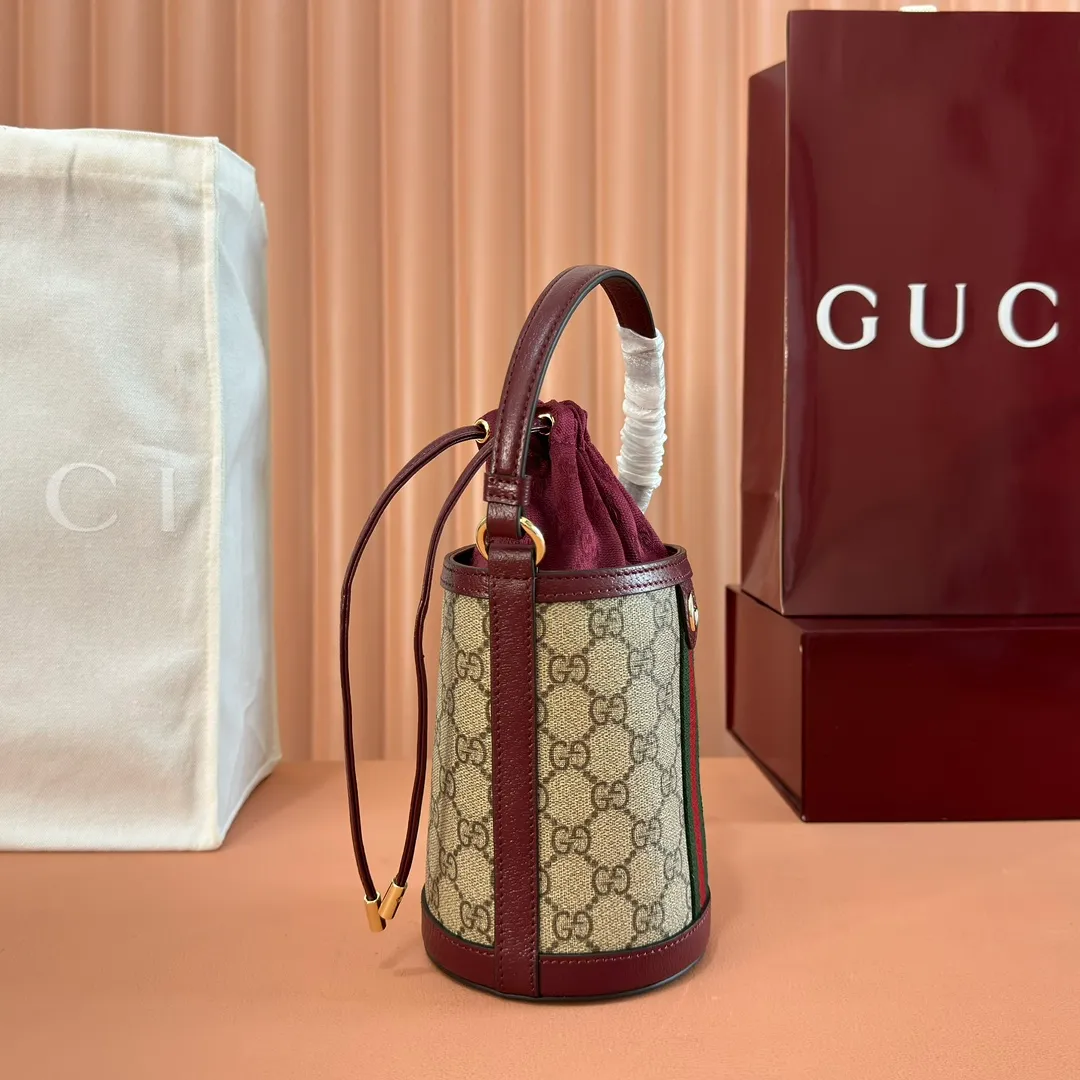 p1000💋💋💋"With full set of original counter packaging" [New Product] The Ophidia series ingeniously interprets novel silhouettes and functions, with iconic beige and brown colors, creating a bag with soft texture and fashionable style. This bucket bag features a top handle and a shoulder strap. Beige and dark brown GG monogram coated fabric Gucci Rosso Ancora leather trim Light gold tone hardware Gucci Ancora taffeta lining and green cotton linen lining Double G webbing handles (12 cm high) removable and adjustable leather shoulder strap (52 cm high) drawstring fly Ident: 838462. Dimensions: 11.5cm (width) x 23cm (height) x 8cm (depth) Weight: approx. 312g Color: Brown Anchor Red/PVC. Made in Italy
