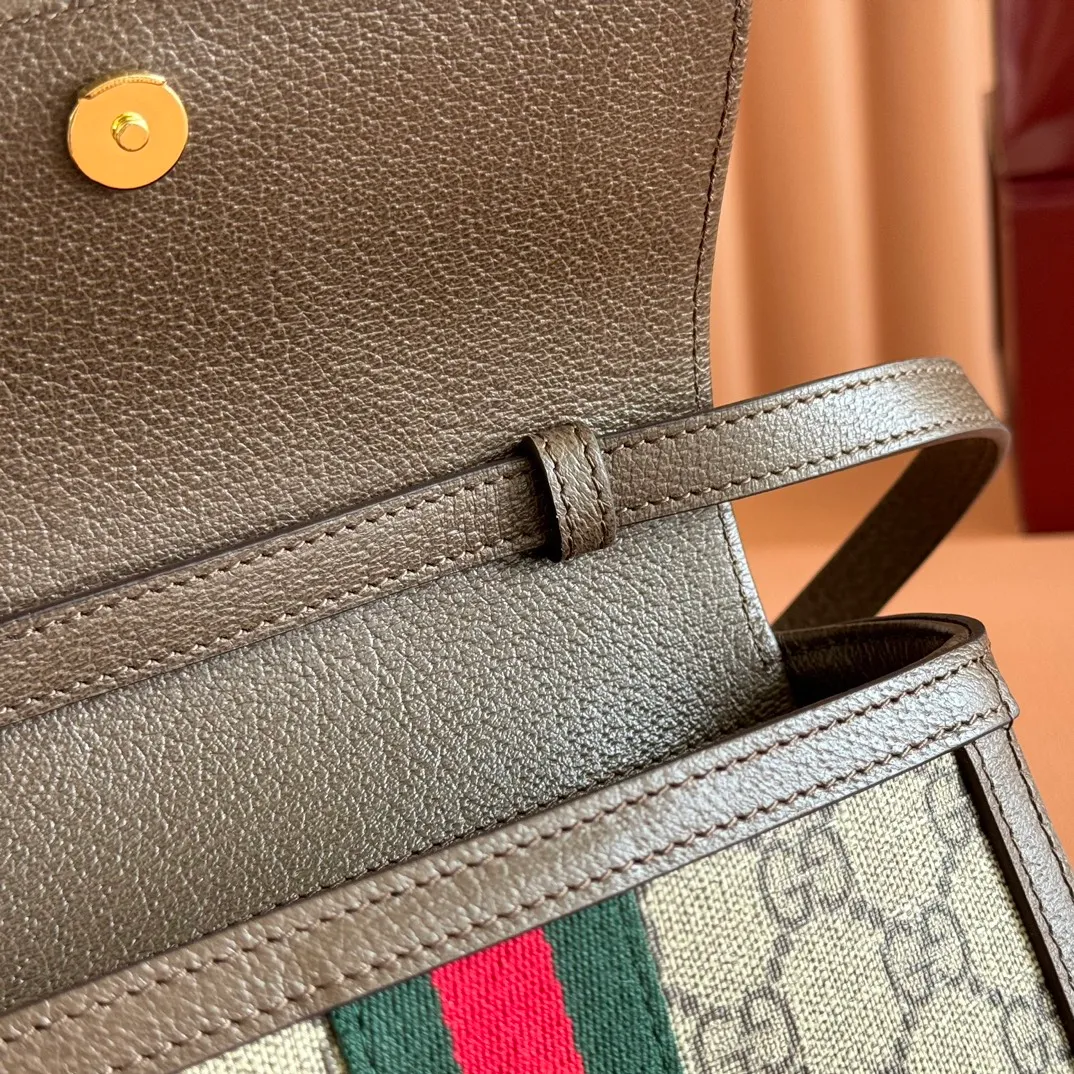p920. 💋💋💋"With full set of original counter packaging" [New product] The Ophidia series combines two colors of beige and dark brown, with classic silhouettes and new functions, and is made of soft-touch fabrics. This mini bag is made of coated fabric with a GG monogram pattern and is intricately embellished with the Double G logo and web details. Beige and dark brown GG monogram coated fabric Dark brown leather trim Gold-tone hardware Brown moiré fabric lining Double G Web detail Interior: Two card compartments Adjustable canvas shoulder strap (height: 36cm - 66cm) Magnetic snap closure Ident No.: 838599. Dimensions: 18.5cm (width) x 12cm (height) x 5cm (depth) Color: Brown/PVC. Made in Italy