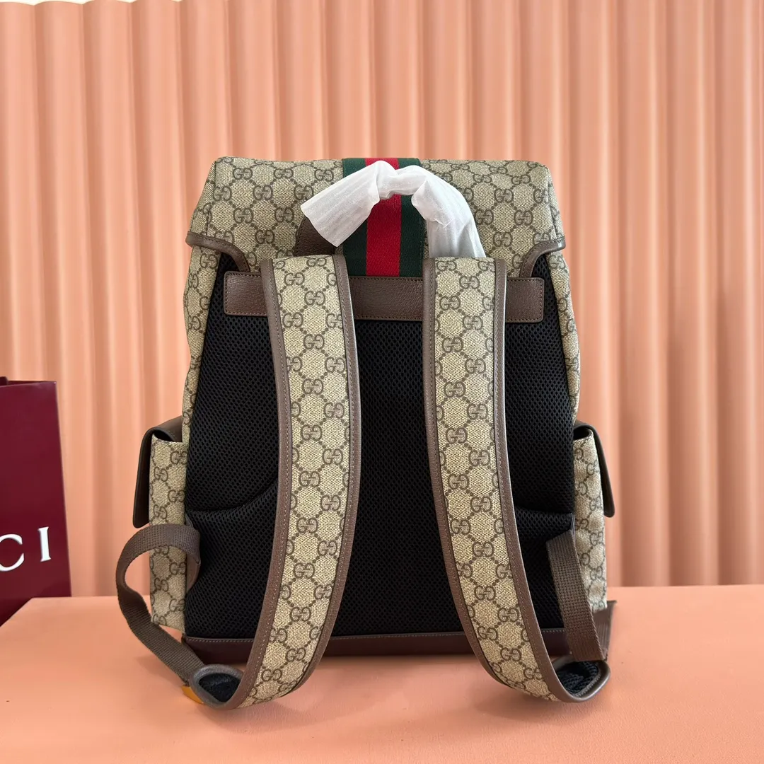 p1280. 🔥🔥🔥【With full set of original green gift bag】Ophidia series medium GG backpack. The 2024 early spring series renews the Ophidia series shoulder bags, tote bags and handbags in black GG denim, and the silver-toned accessories present a contrasting metallic texture. This Ophidia backpack in blue and black GG Supreme canvas demonstrates Gucci's design prowess in infusing the brand's iconic design elements with a modern appeal. Blue and black GG Supreme canvas, black leather piping, palladium tone hardware, cotton and linen blend lining, black mesh Double G on the back, flap side pockets with magnetic closure, inner phone pocket and padded tablet sleeve, adjustable shoulder strap, black mesh back, drawstring flap design, leather buckle fastening strap and extra magnetic buckle for easy opening and closing, weight: approx. 1.272 kg. Model: 598140. Dimensions: 40(length) x 24(width) x 16cm(thick) Color: Brown/PVC. Made in Italy